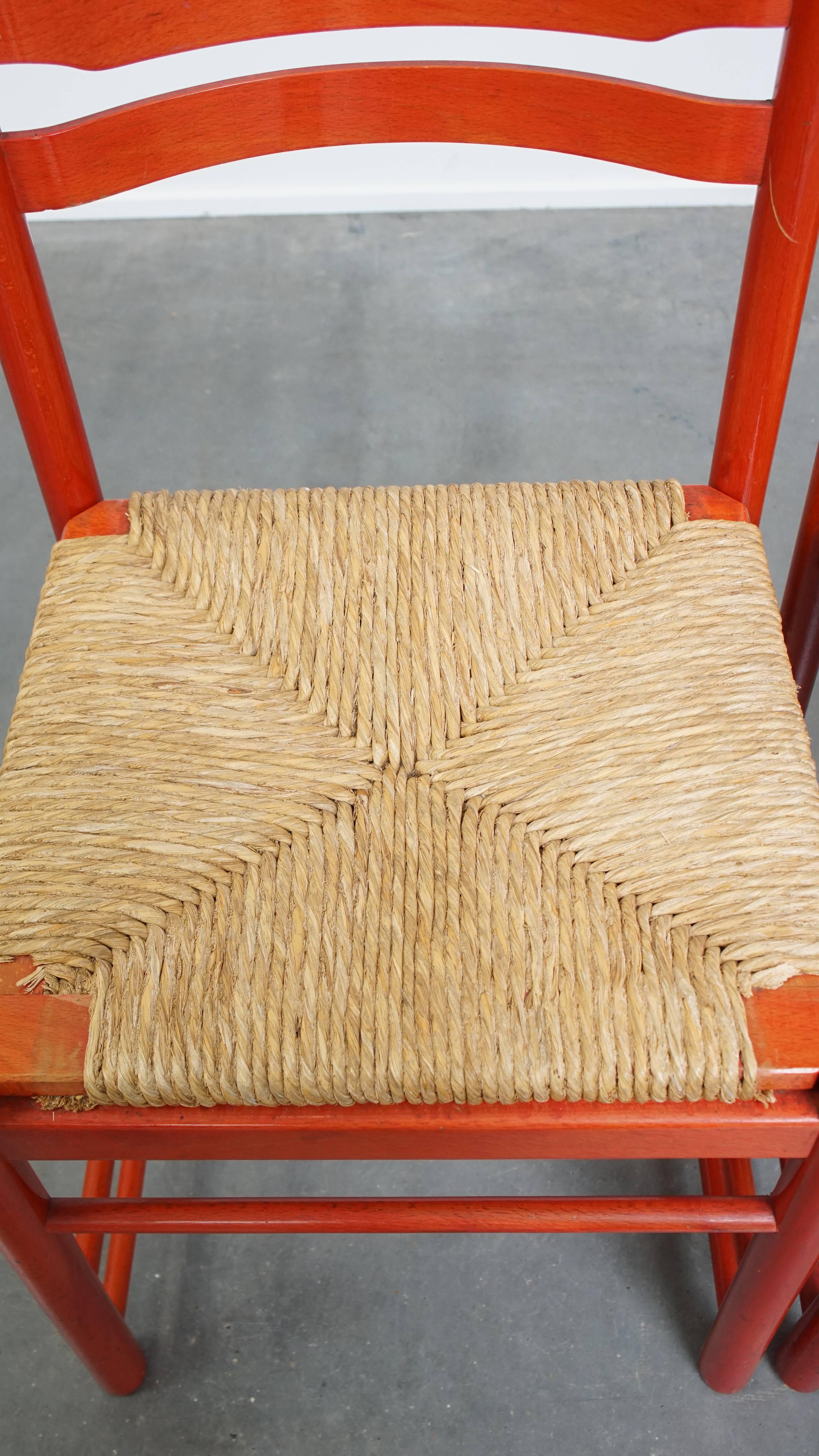 Wicker Set of 3 red vintage wooden chairs from the 1970s with a woven wicker seat For Sale