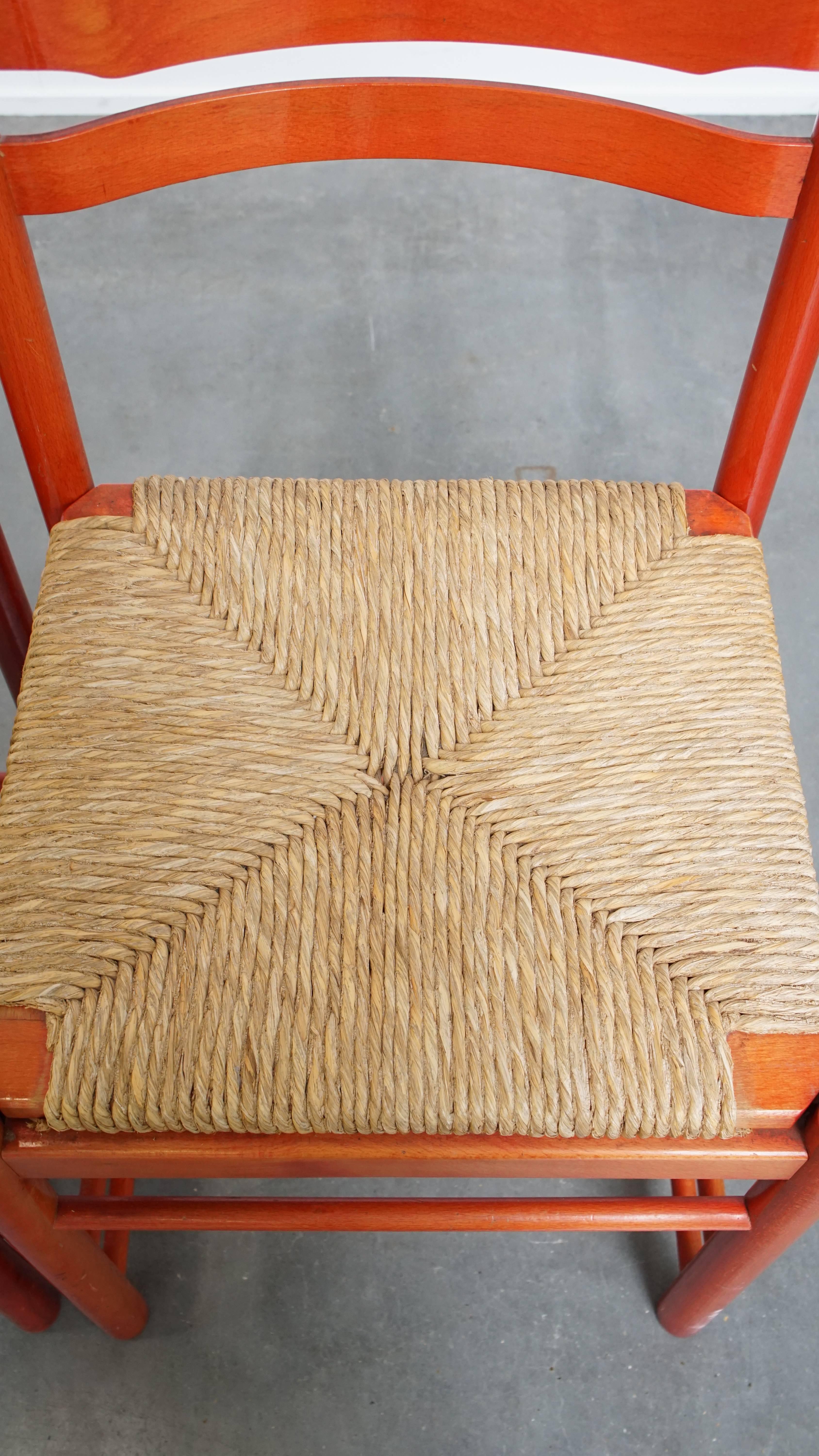 Set of 3 red vintage wooden chairs from the 1970s with a woven wicker seat For Sale 2