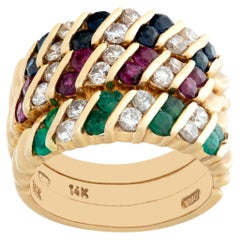 Set of 3 rings in yellow gold with diamonds sapphires, rubies, emeralds