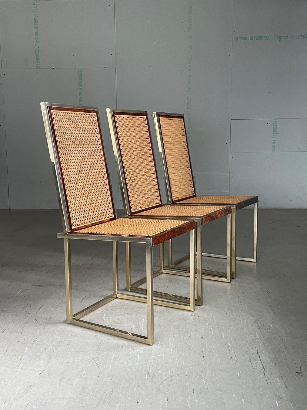 Set of 3 incredibly stylish 1970's Romeo Rega Hollywood Regency high-backed dining chairs. Brass plated metal construction. Cane work backrest and seat with a beautiful walnut surround. 

Design: Romeo Rega 1970 - 1979. 
Measurements: Depth: 48cm 