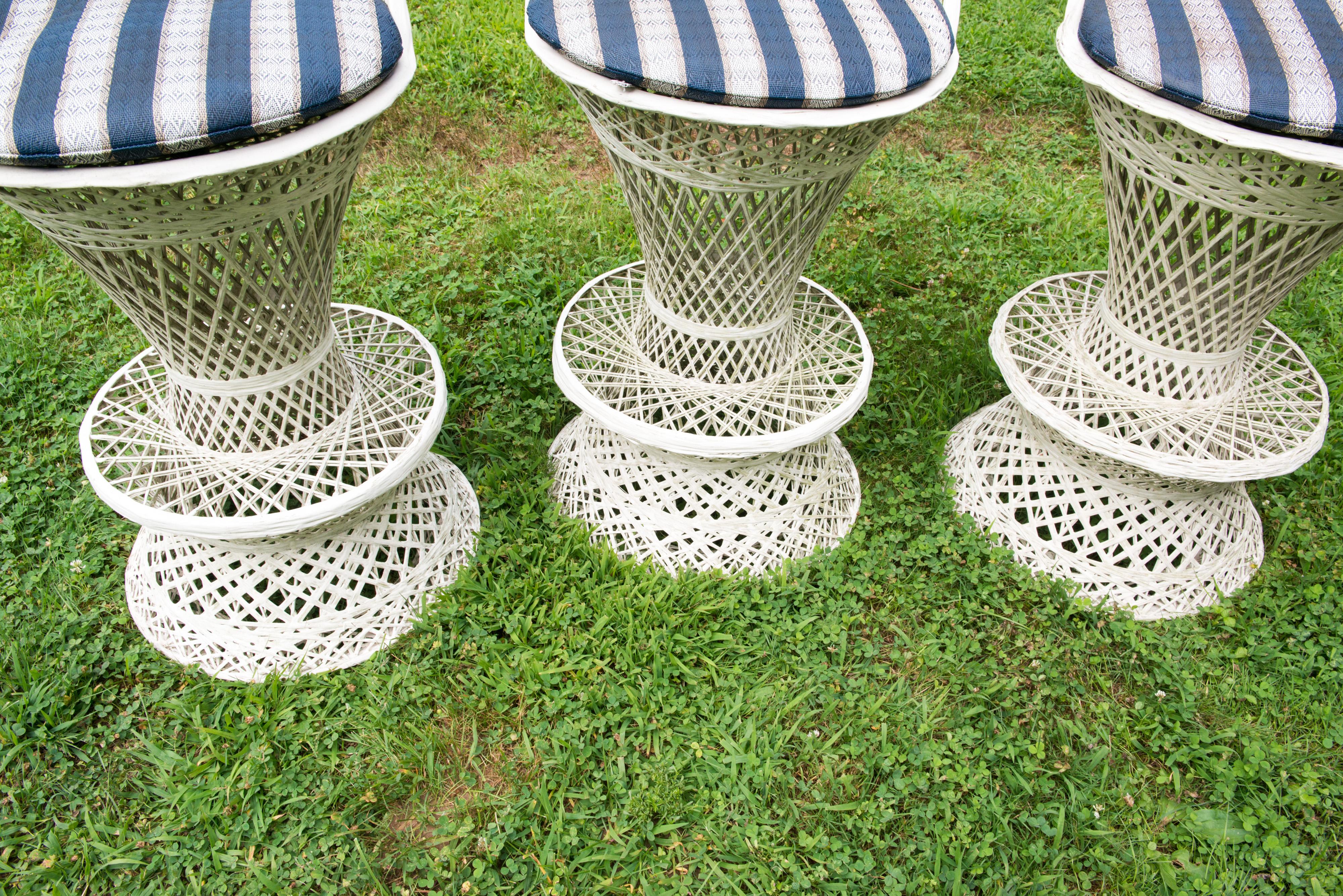 Set of three 1960s Russell Woodard spun fiberglass outdoor stools.