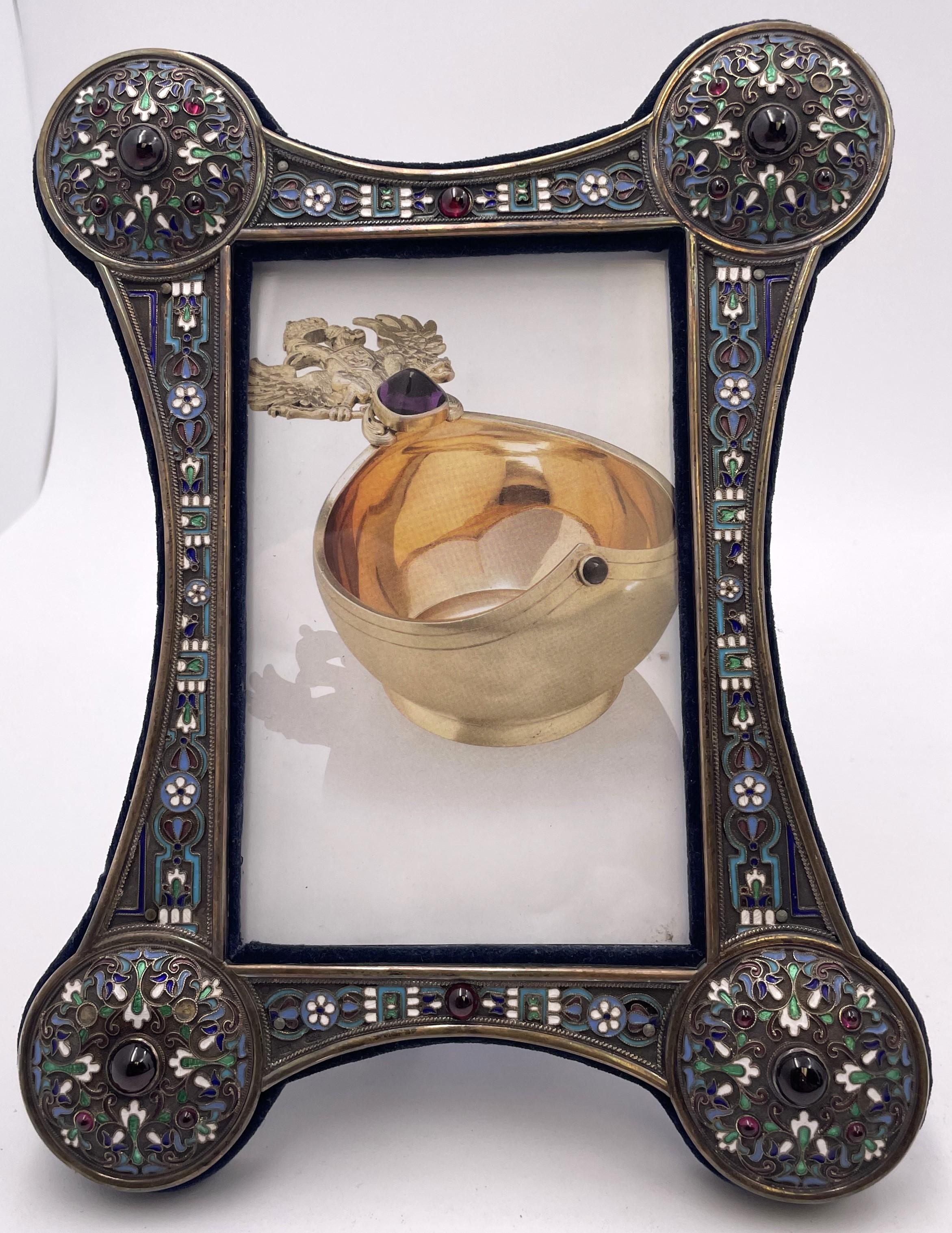 Russian 0.84 silver and enamel set of 3 matching picture frames, from the late 19th century. With exquisite enamel work and felt in the back, they measure 8 2/3'' in height by 6 3/4'' in width by 3/4'' in depth (photo size is 3 3/4'' by 5 1/8'') and