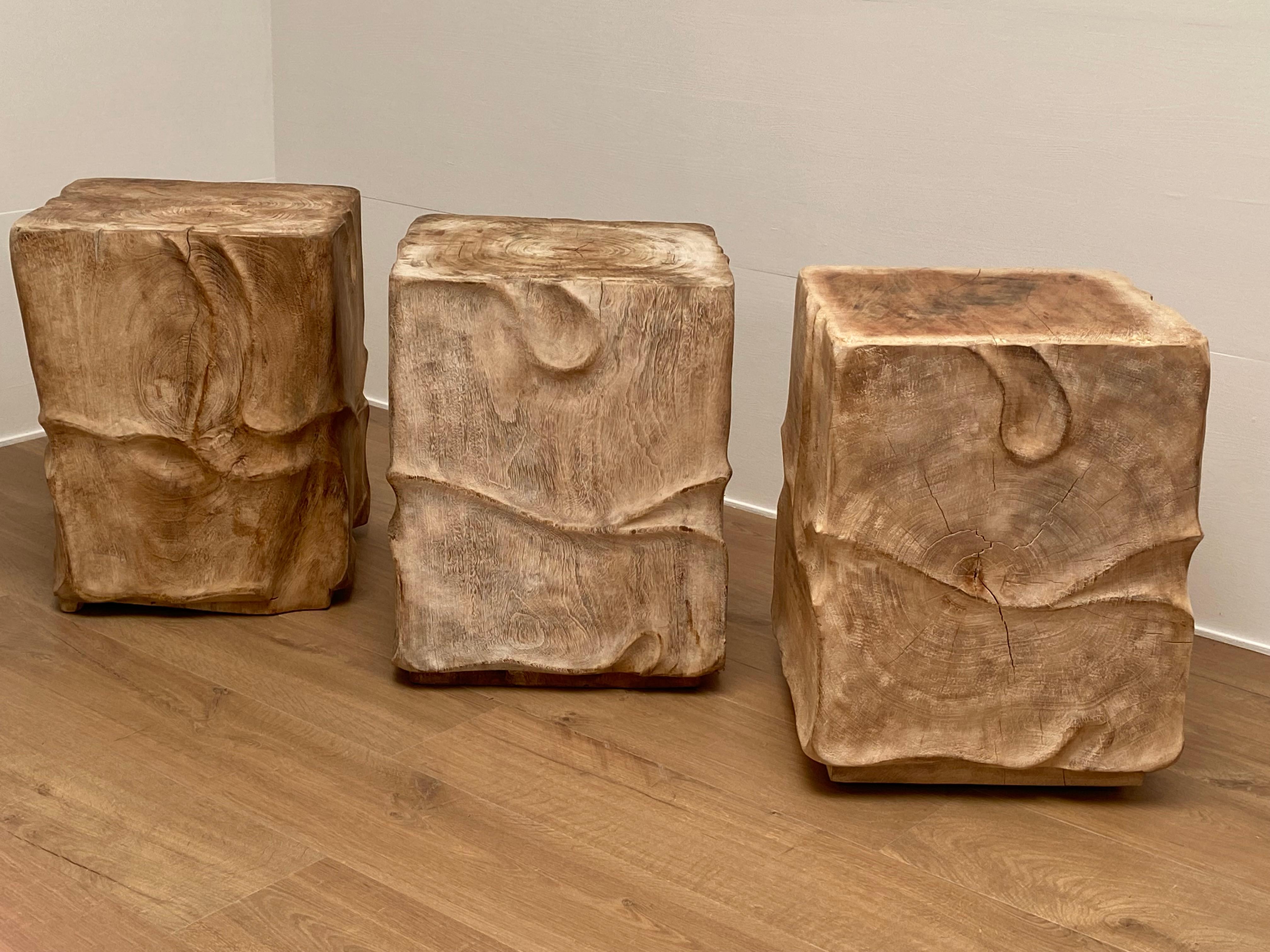 Beautiful Set of 3 Wooden Blocks in SUAR Wood,
decorated with nice, simple carvings,
can be used as side tables or seating ,
can also be used as bed-tables,
nice shine and patina of the Suar Wood.