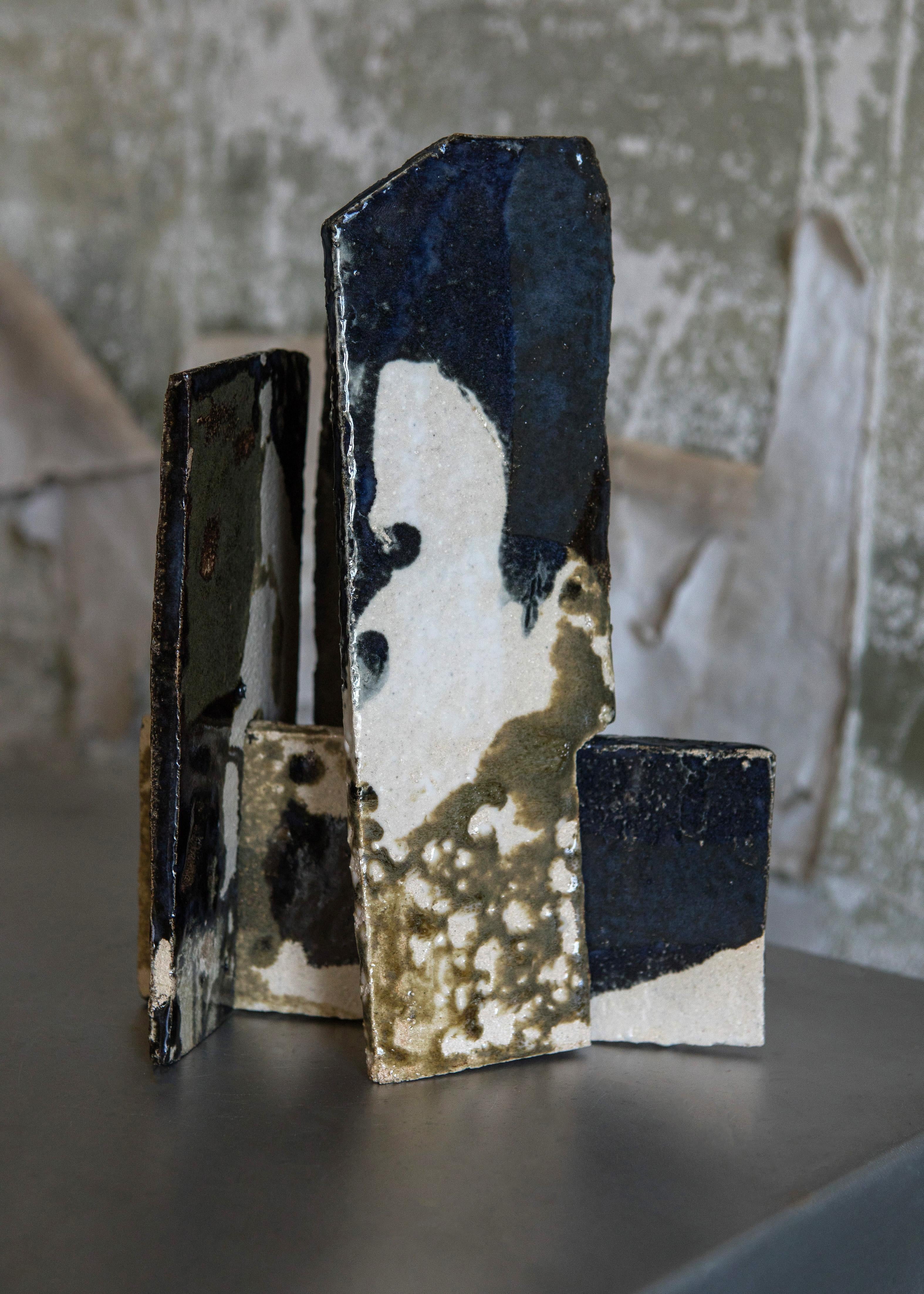 Set Of 3 Sandstone S Decorative Objects by Mylene Niedzialkowski
Unique Pieces.
Dimensions: Ø 22 x H 25,5 cm. 
Materials: Sandstone and enamel.

Modules composed of 2 or 3 glazed stoneware slabs, hand- crafted piece by piece to create a unique