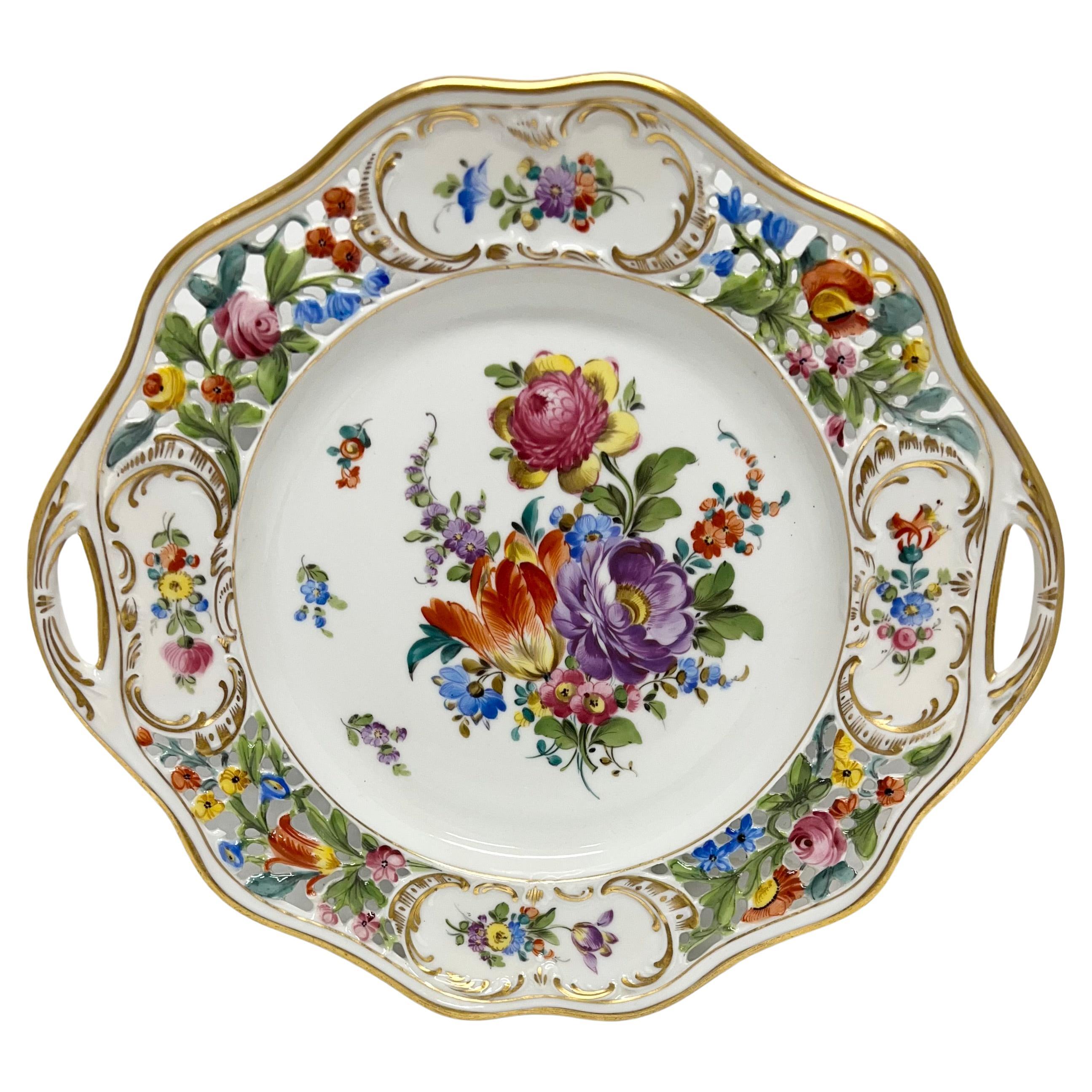 Three decorative porcelain serving dishes, including a circular dish and oval dish with handles.  Two of the dishes are by Schumann-Bavaria in the 'CHATEAU' pattern and are hand painted with leaves and flowers in pinks, violet, green, blues, orange