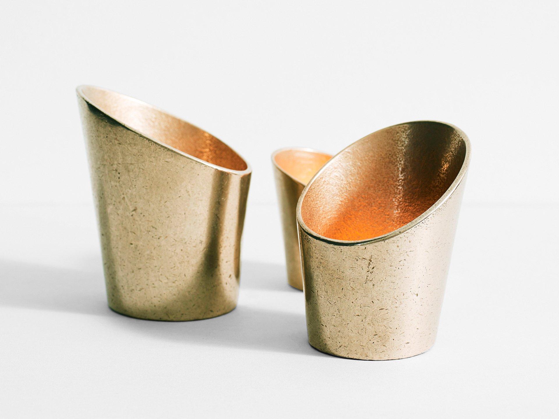 Set of 3 Sheath Tealight Holders by Henry Wilson
Dimensions: D 9 x H 11 cm (Dimensions may vary between pieces)
Materials: Brass

The sheath tealight holders utilise the reflectivity of soid brass to create a warm atmospheric glow. They are designed