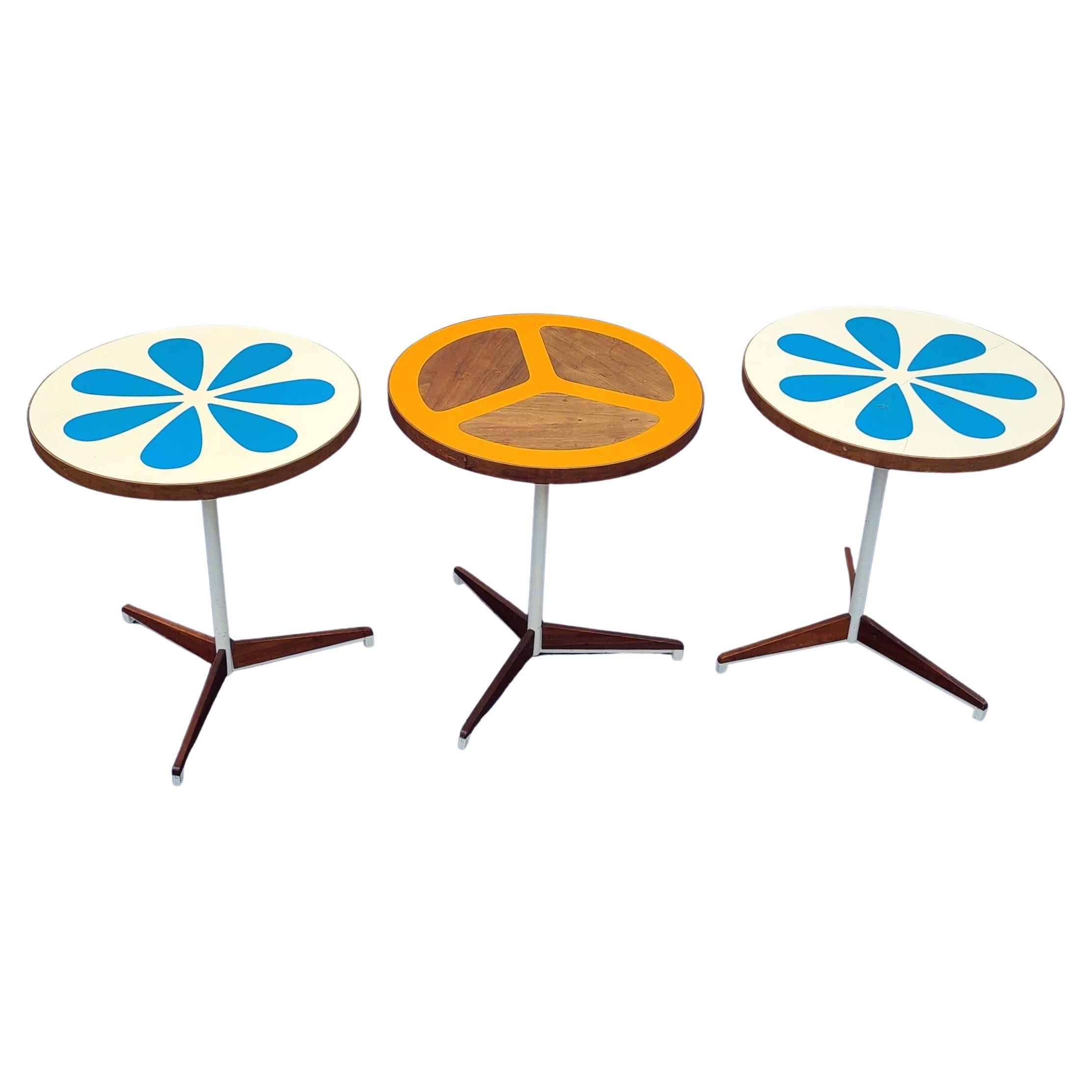 Please message us for a cost effective shipping quote to your location.

Set of 3 California Modern Adjustable Pedestal Tables. Designed by Don Savage and Howard McNab for Peter Pepper Products. Plastic Resin Tecnique with Walnut details. One blue