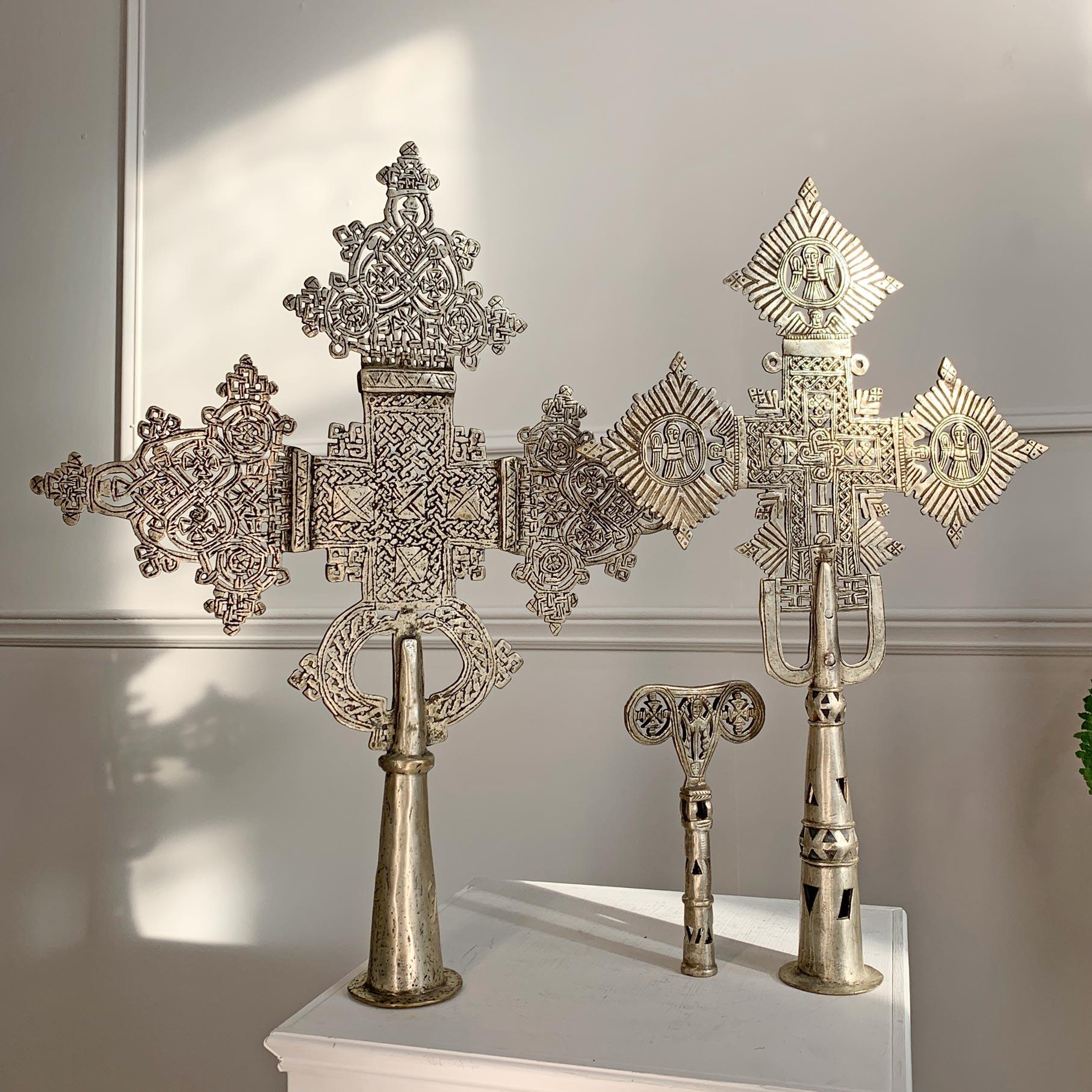An exceptional set of 3 hand crafted Abyssinian Processional Crosses, dating to the late 19th/early 20th century, heavy pieces, finished in silver plate. 



Three types of crosses were made in Ethiopia: those worn around the neck, those intended to