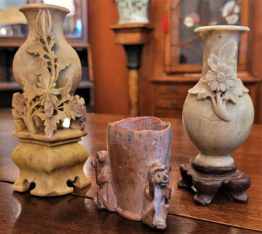 Presenting a lovely set of 3 small Chinese carved soapstone vessels.

Made in China in the early 20th century circa 1930. The middle one could be older.

This set consists of:

A mottled tan vase/urn on stand with floral carving relief
A