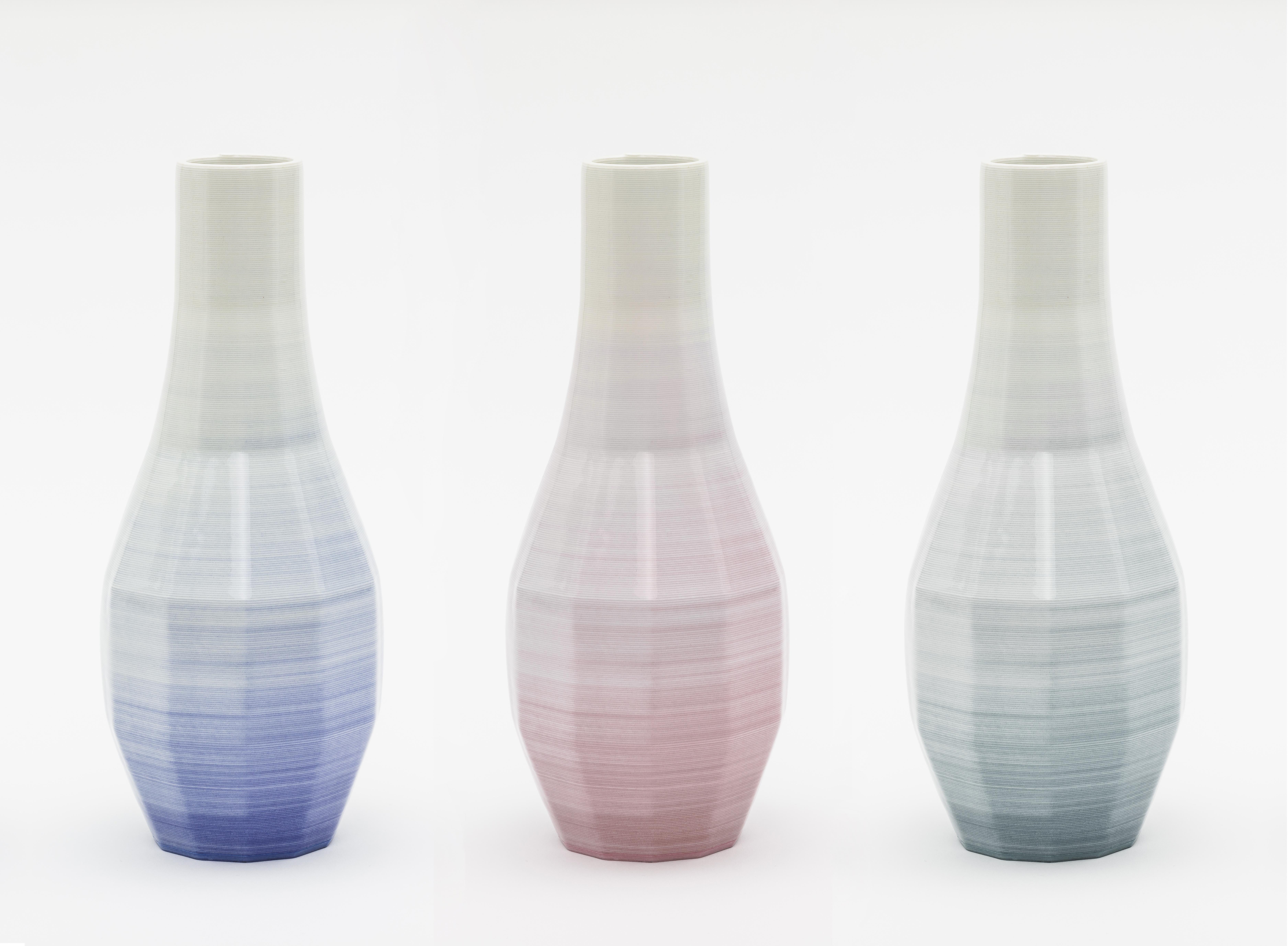 Set of 3 small porcelain Gradient vase by Philipp Aduatz
Limited Edition of 100
Dimensions: 11 x 11 x 26,5 cm
Materials: 3D printed porcelain

The inspiration and tool for the design of the Gradient vase was subdivision modelling, a computer