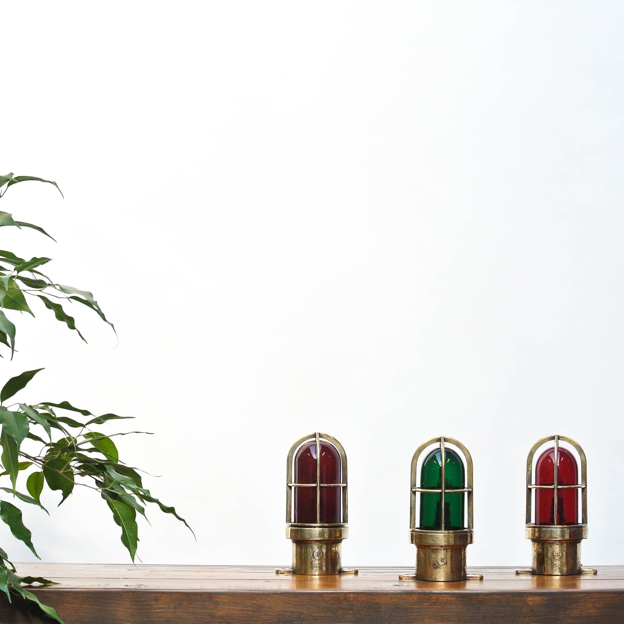 Set of 3 old small Signal lamp in brass, 2 of them with red glass, 1 with green glass. Perfect for a bright decoration!

 
