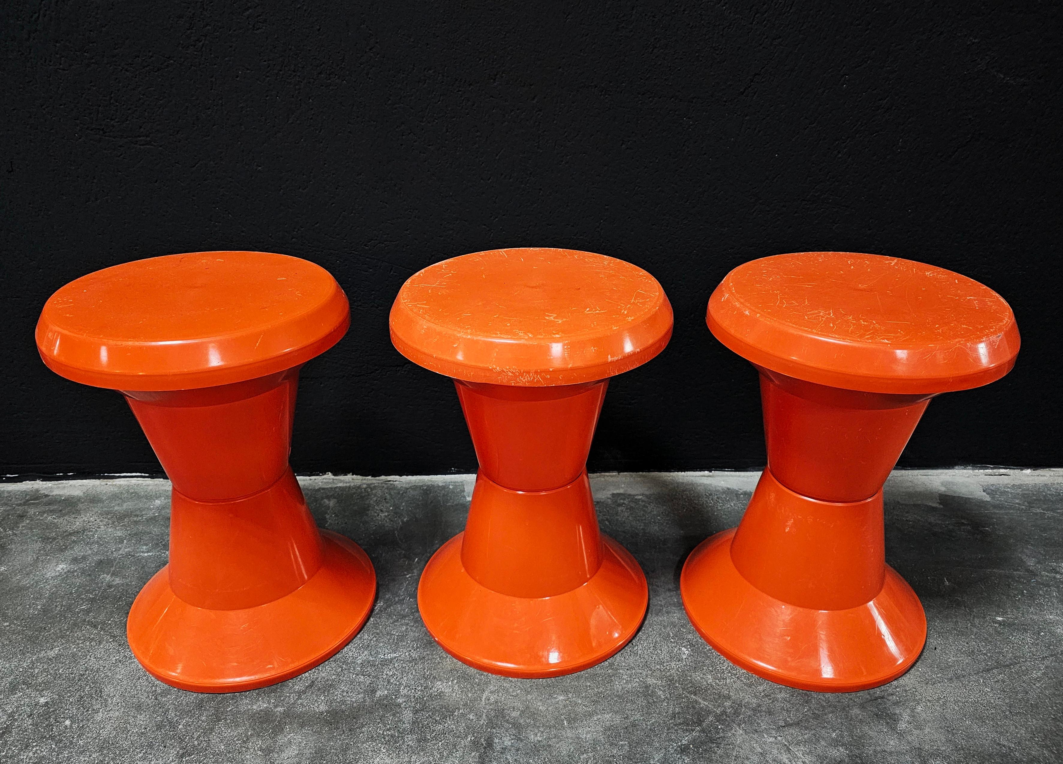 In this listing you will find a set of 3 orange space age stools manufactured by Kovinoplatika Yugoslavia, in 1970s. They feature very practical design, allowing you to easily stack them one into the other and store them away when not needed. They