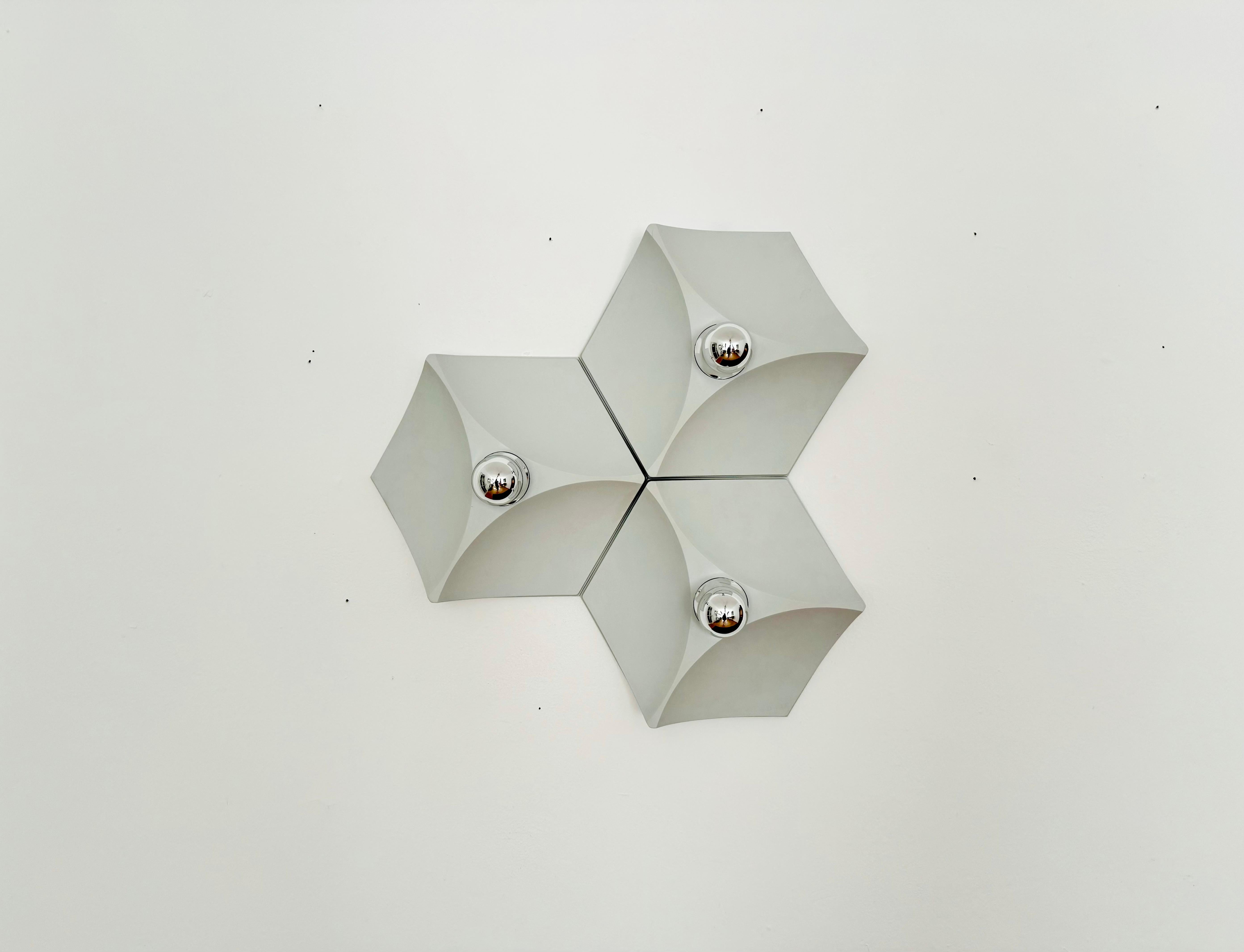 Wonderful Space Age wall or ceiling lamp from the 1960s.
The plastic lamps are manufactured to a very high quality.
Very contemporary design with a fantastic look.
A spectacular play of light is created.
The modules can be combined
