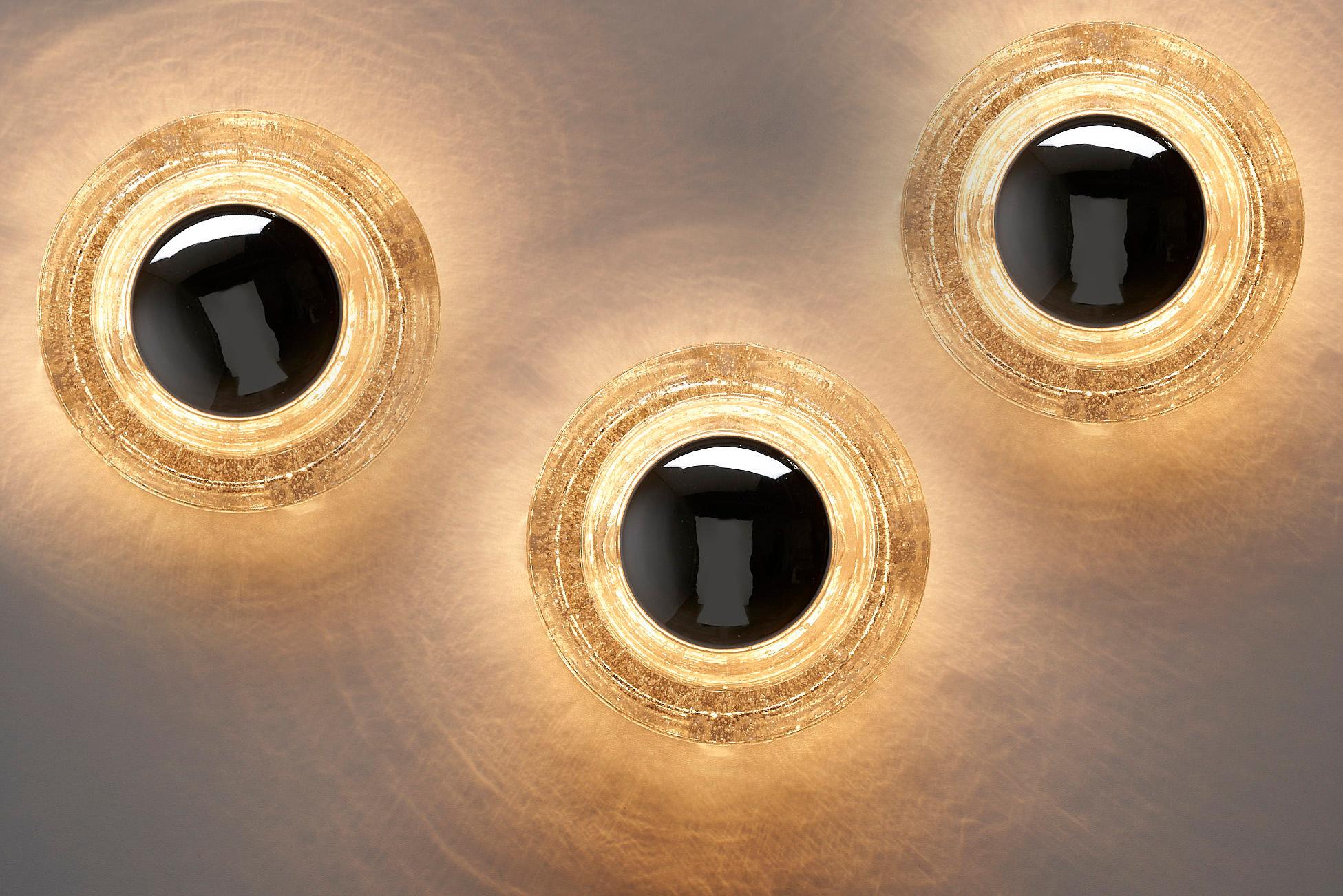 Introducing a remarkable Set of 3 Space Age Wall Sconces by WILA, Germany, dating back to the 1960s. These unique wall or ceiling lamps come together to create a captivating and visually striking decor when displayed as a set.

Each lamp features a