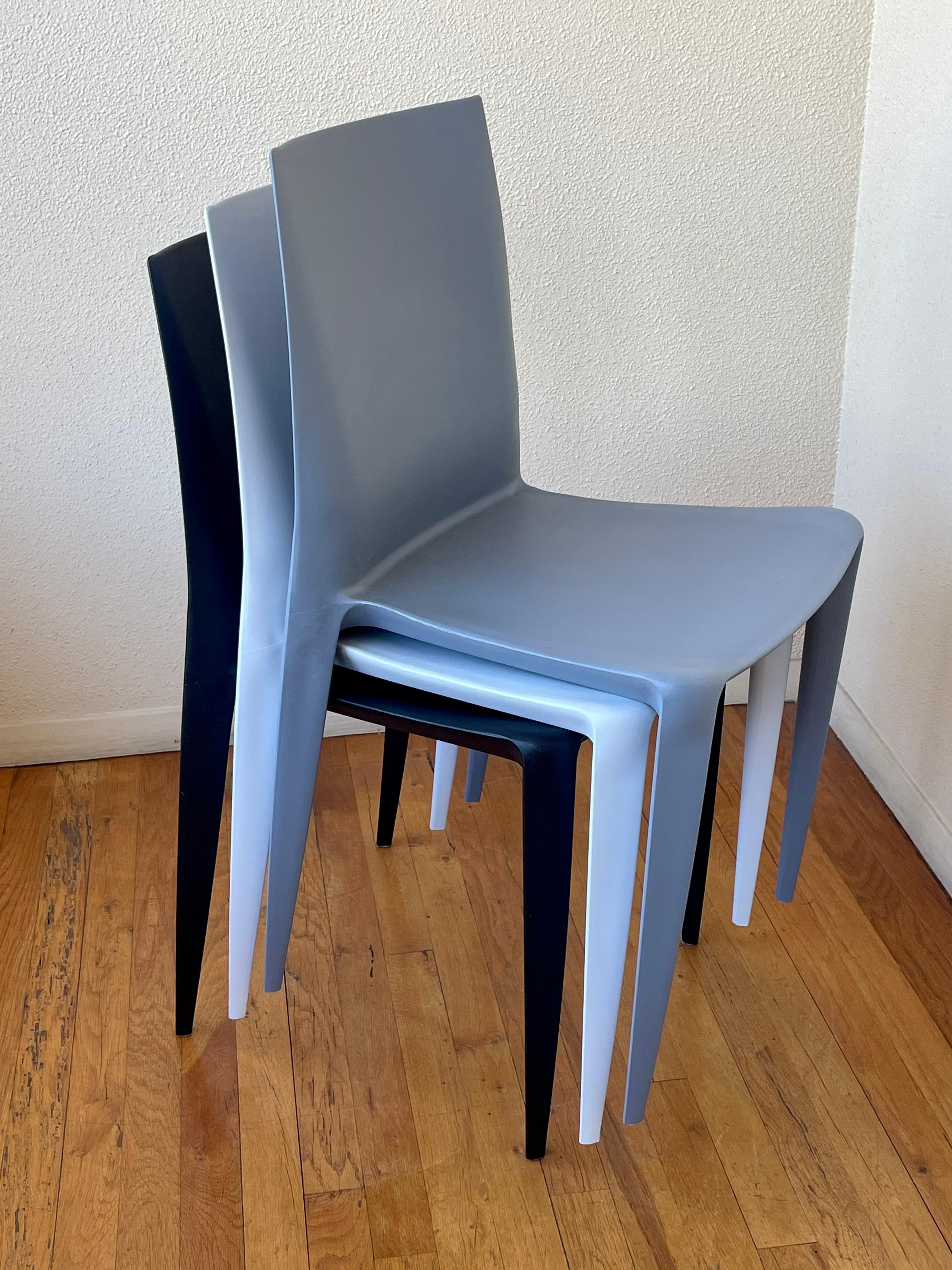 Nice set of 3 stackable chairs designed by Mario Bellini for Heller great colors and condition its like new, made in Italy. Grey, white & black.