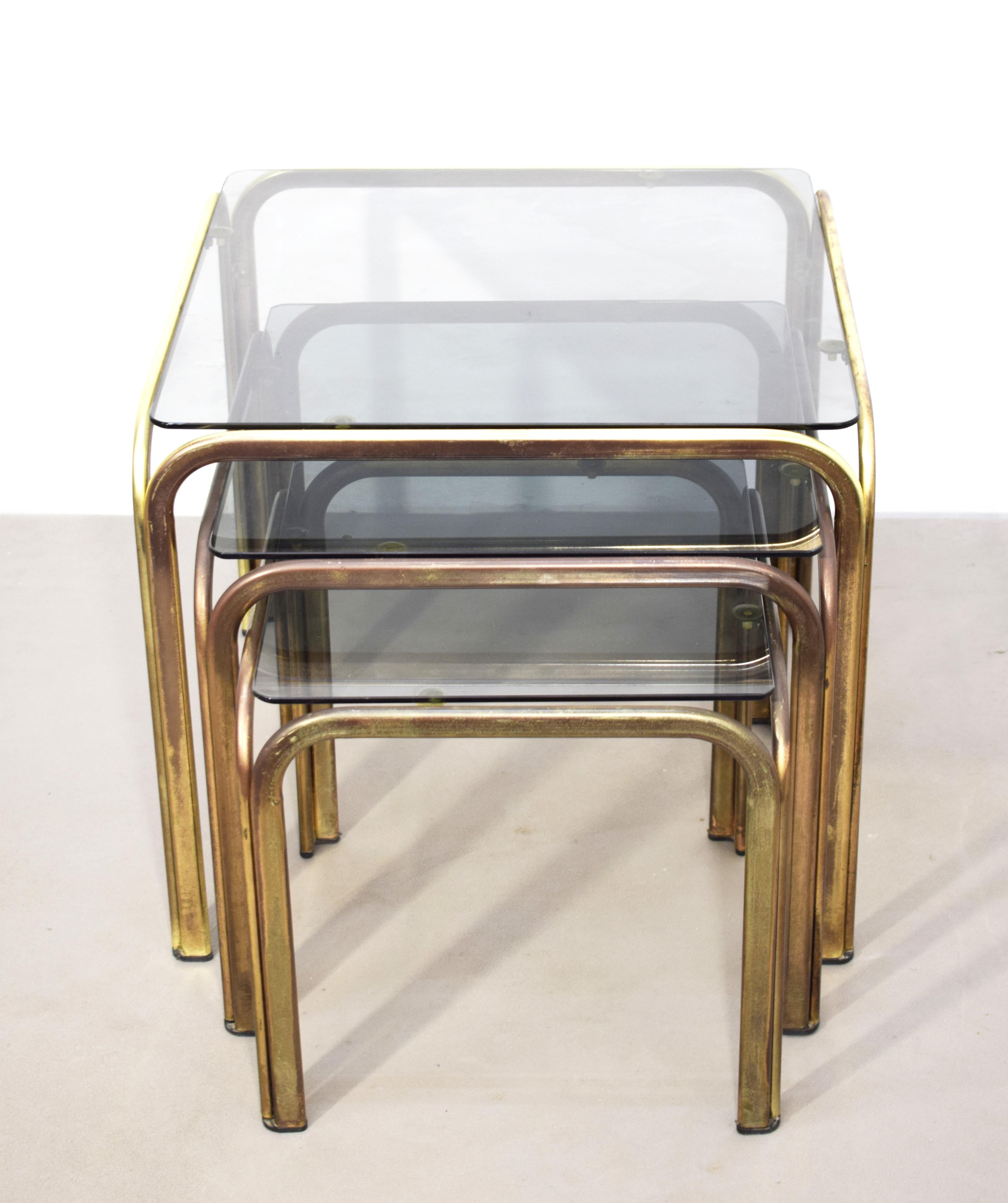 Mid-Century Modern Set of 3 stackable coffee tables, brass and smoked glass, 1970s. For Sale