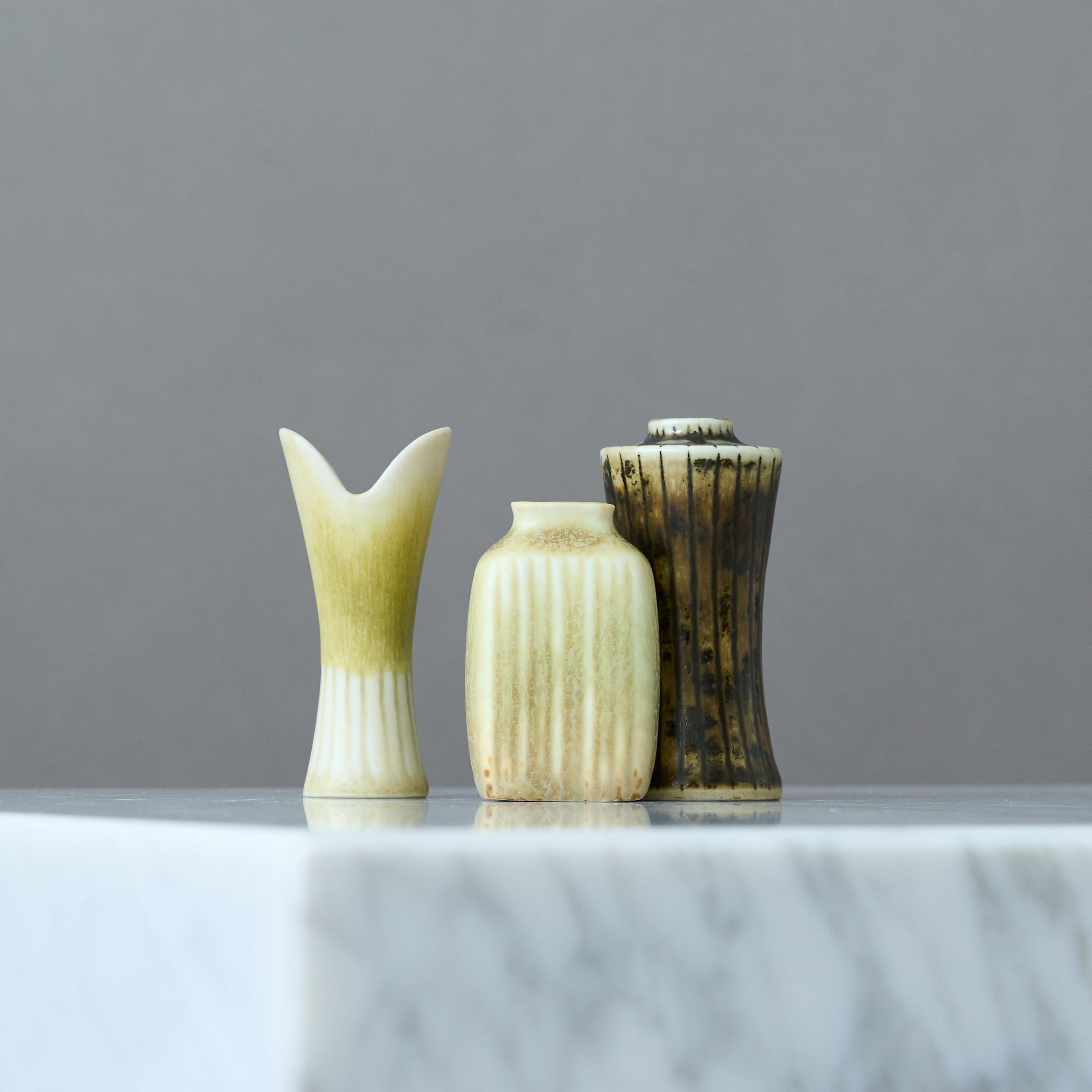 A set of three beautiful yellow and brown stoneware miniature vases with amazing glaze. 
One of them is by Gunnar Nylund and two of them are by Carl Harry Stalhane for Rorstrand, Sweden, 1950s.

Great condition. 
Signed with 'GN', 'CHS' and makers