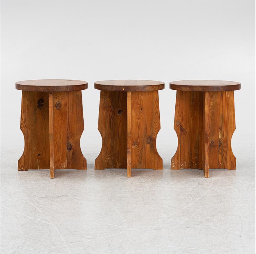 Set of 3  Swedish midcentury stools in Axel Einar Hjorth Style.
Stained pine.