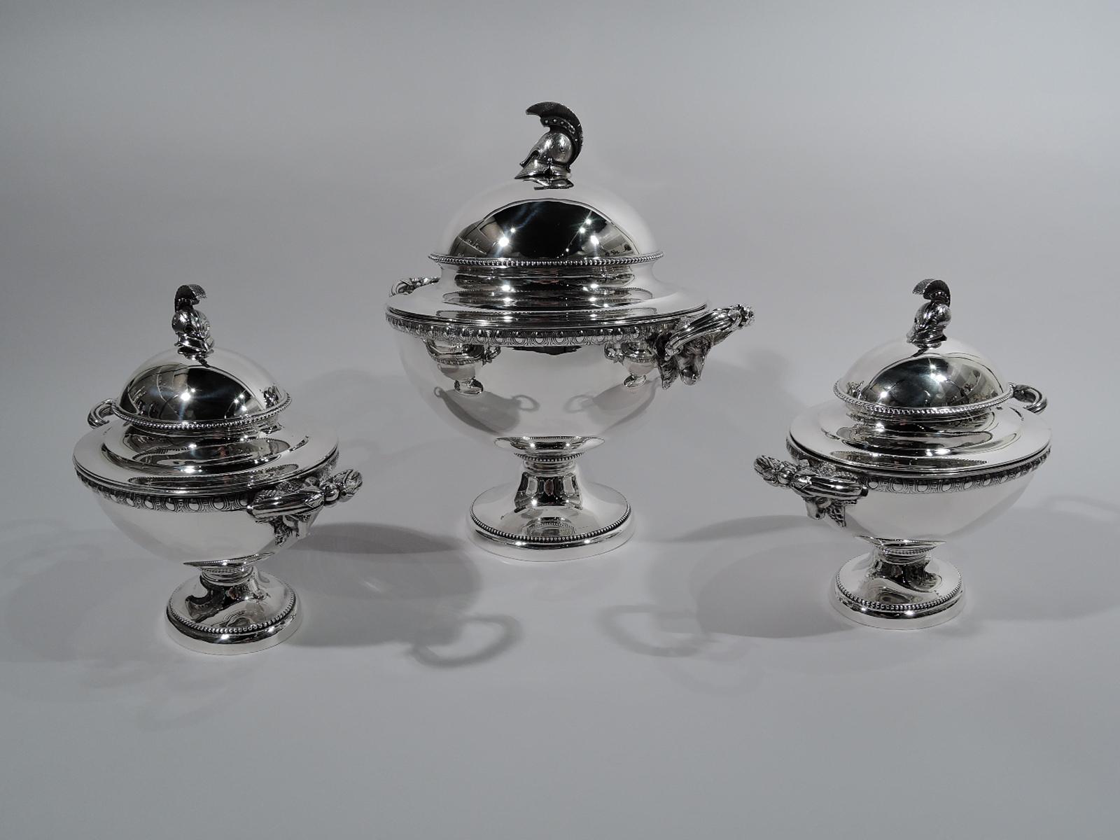 Set of 3 Etruscan Revival sterling silver tureens. Made by JC Moore & Son for Tiffany & Co. in New York, circa 1865. This set comprises 1 large round tureen and 2 small oval tureens.

Each: Tapering, ovoid body on raised foot. Egg-and-dart border.