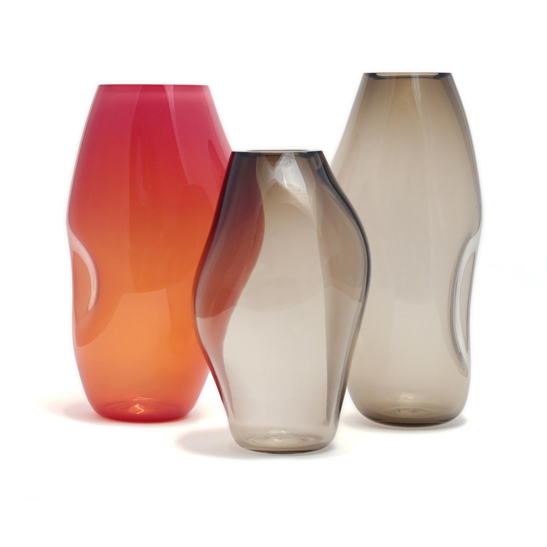 Set of 3 Supernova IV L/M/ L vases by ELOA
No UL listed 
Material: glass
Dimensions: D15 x W17 x H41 cm/ D15 x W17 x H36 cm
Also available in different colours and dimensions.

SUPERNOVA is a collection of vases and bowls that, though they don‘t