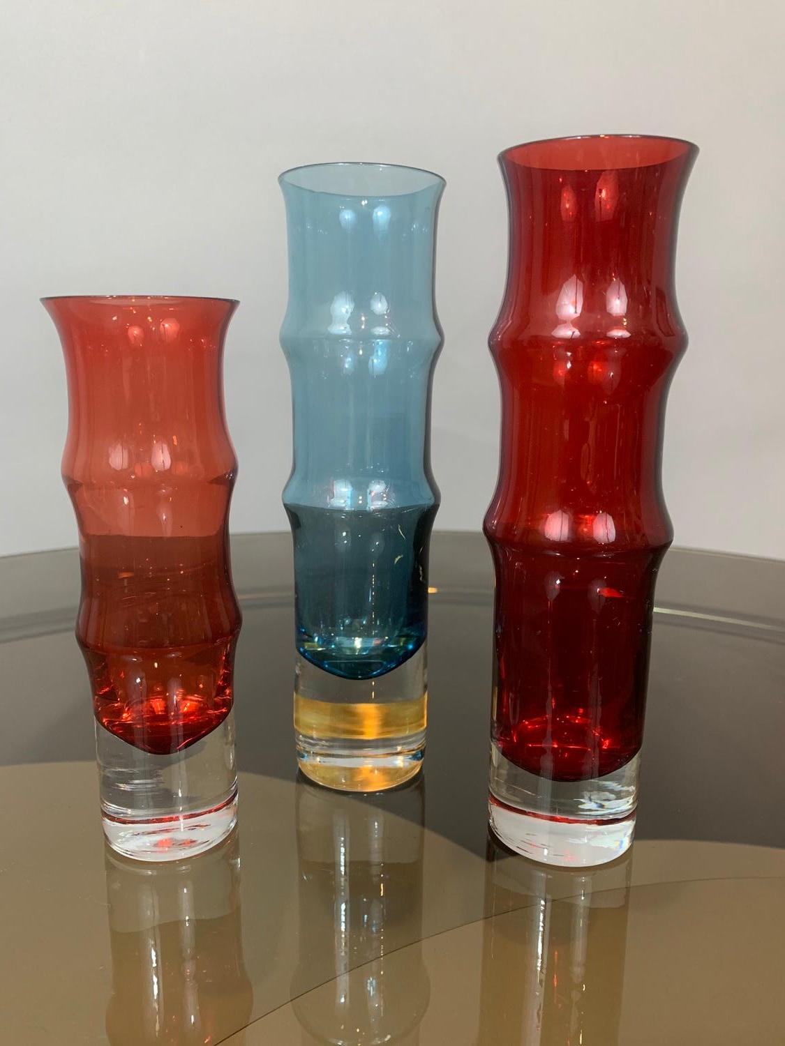 Set of 3 hand blown small art glass vases in red, ruby red and blue. Made in Sweden in the late 1960s-early 1970s in the shape of bamboo shape. Designed by Bo Borgstrom for Aseda Glasbruk. Start a collection! All in very good vintage condition with