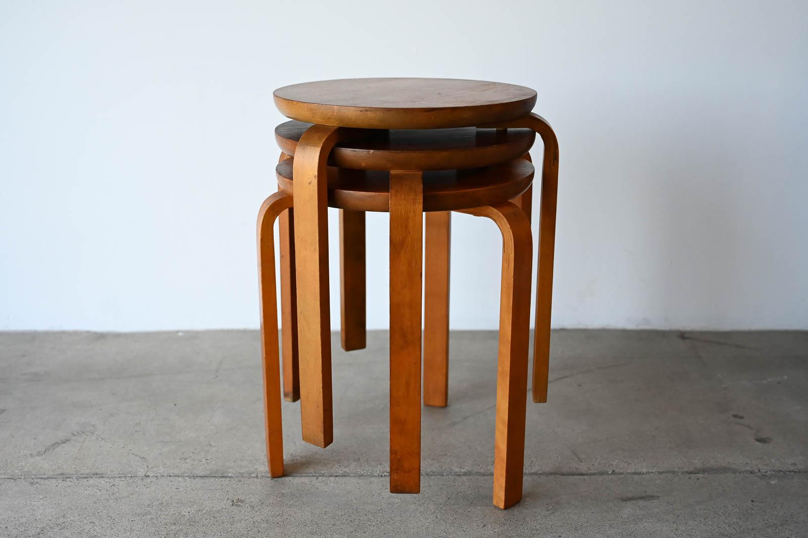 Swedish Dot Stools in the style of Alvar Aalto, ca. 1950.  Three vintage stools in Teak and bentwood Birch.  All in good vintage condition, some wear to all legs and tops as shown.  In the style of Alvar Aalto.  Stamped Made in Sweden on underside. 
