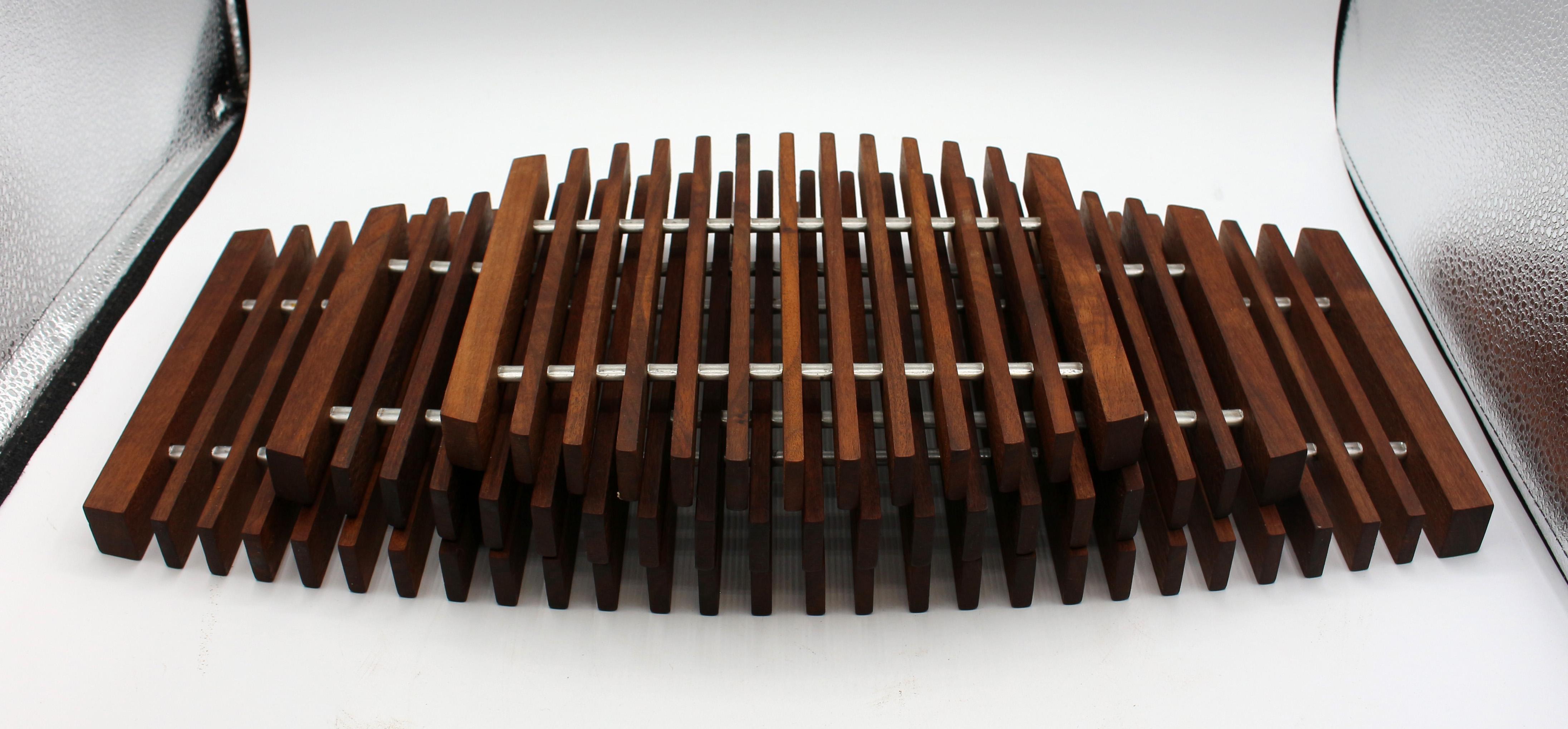 Set of 3 teak & aluminum fishbone trivets, mid century modern, Danish. From a Palm Springs modernism collection, c.1960s. A rare find.
Graduated from 8 3/16