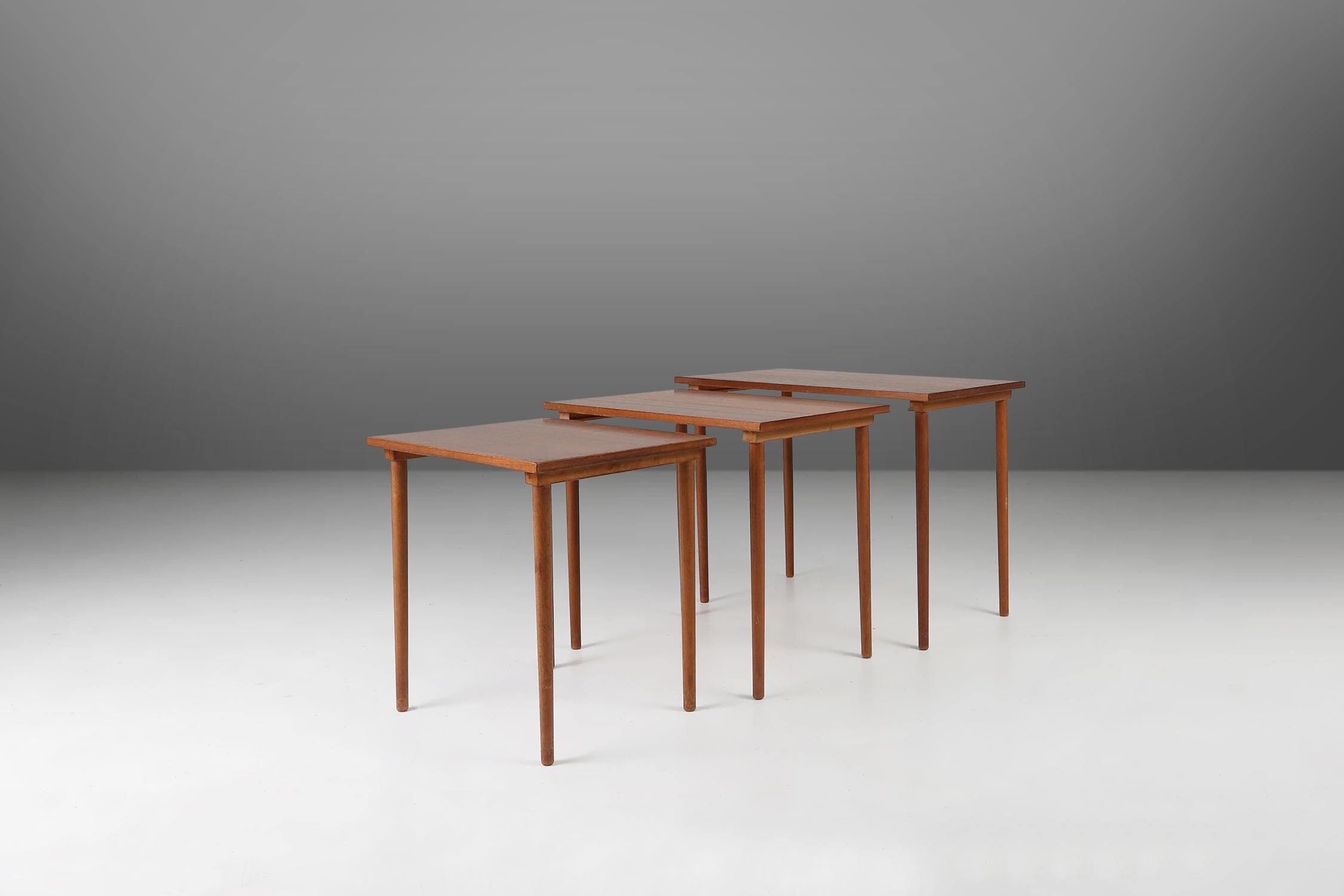 A set of 3 beautifully designed teak wood Scandinavian design nesting tables from Denmark. This set is a perfect example of Scandinavian design from the 1960s. 
These vintage tables are made from high-quality teak wood, showcasing the timeless