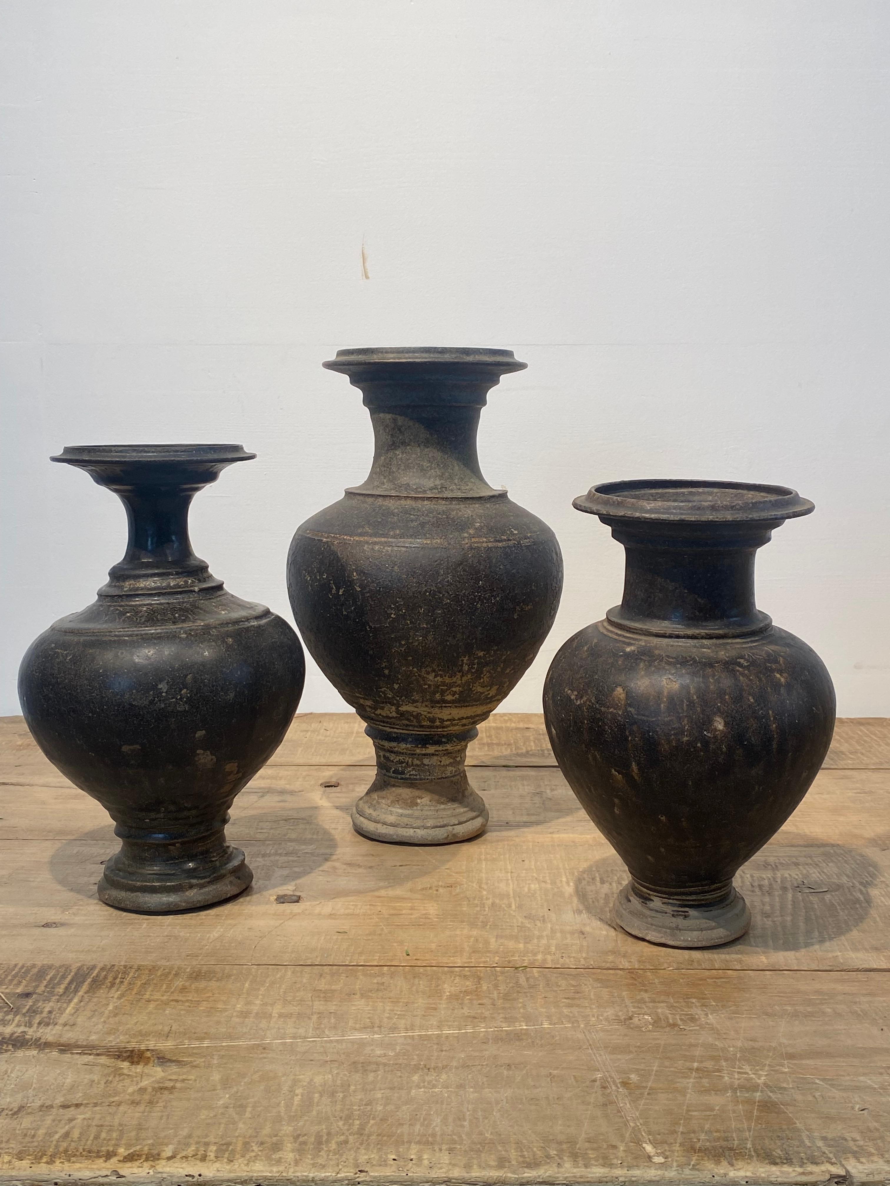 Set of 3 Khmer Vases from the Cambodia-Thailand region in South East Asia,
11-13 th Century,
the vases have a great patina and shine and are very decorative,
fine decorations and simple and elegant design,
the vases are beautiful when decorated in a