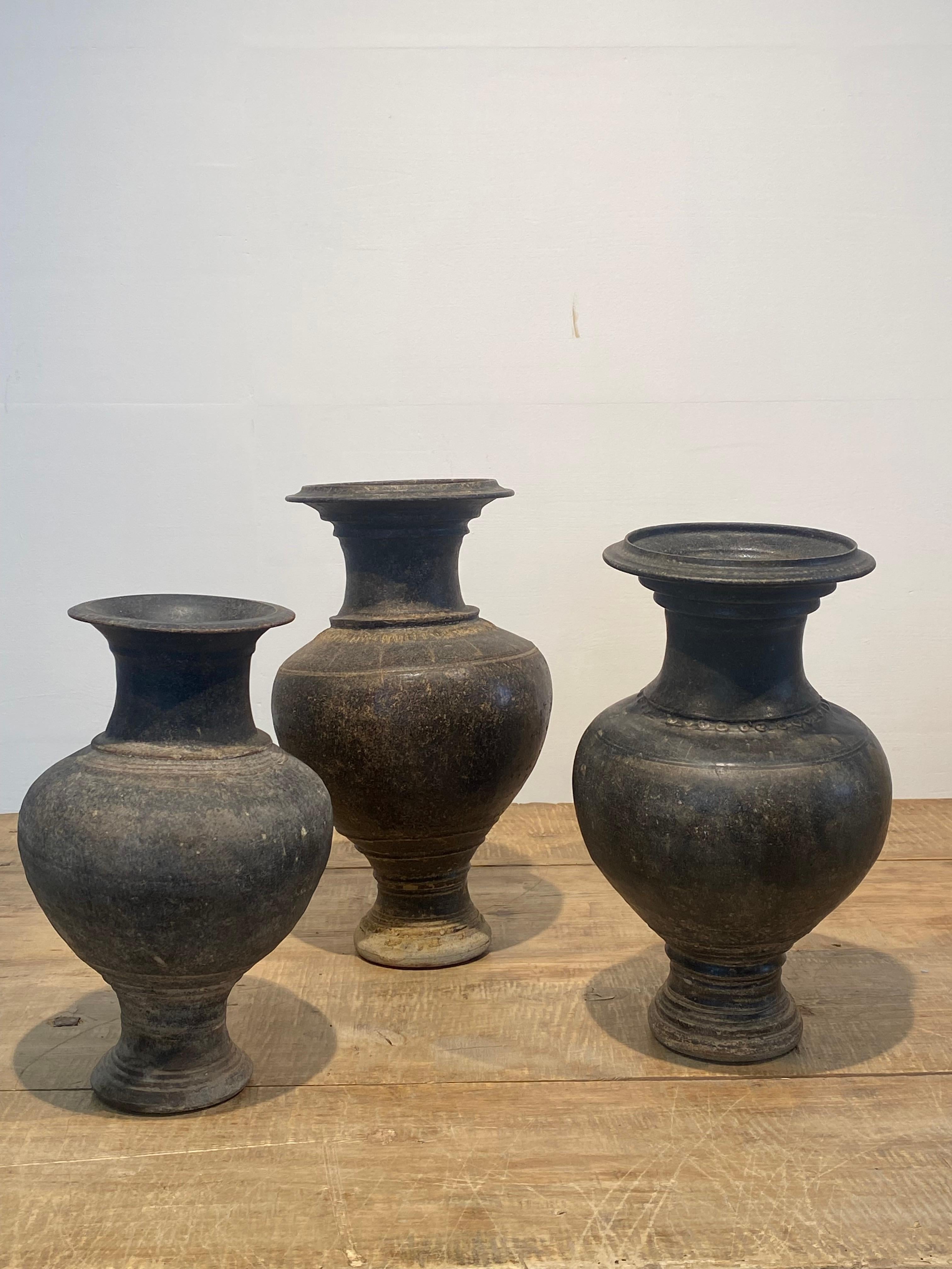 A beautiful set of 3 antique KHMER vases from South East Asia,
from the Thailand-Cambodia area,
good patina and shine of the glazed Brown terracotta,
fine decorations and design of the vases,11-13 th Century,
very decorative vases , ideal to combine