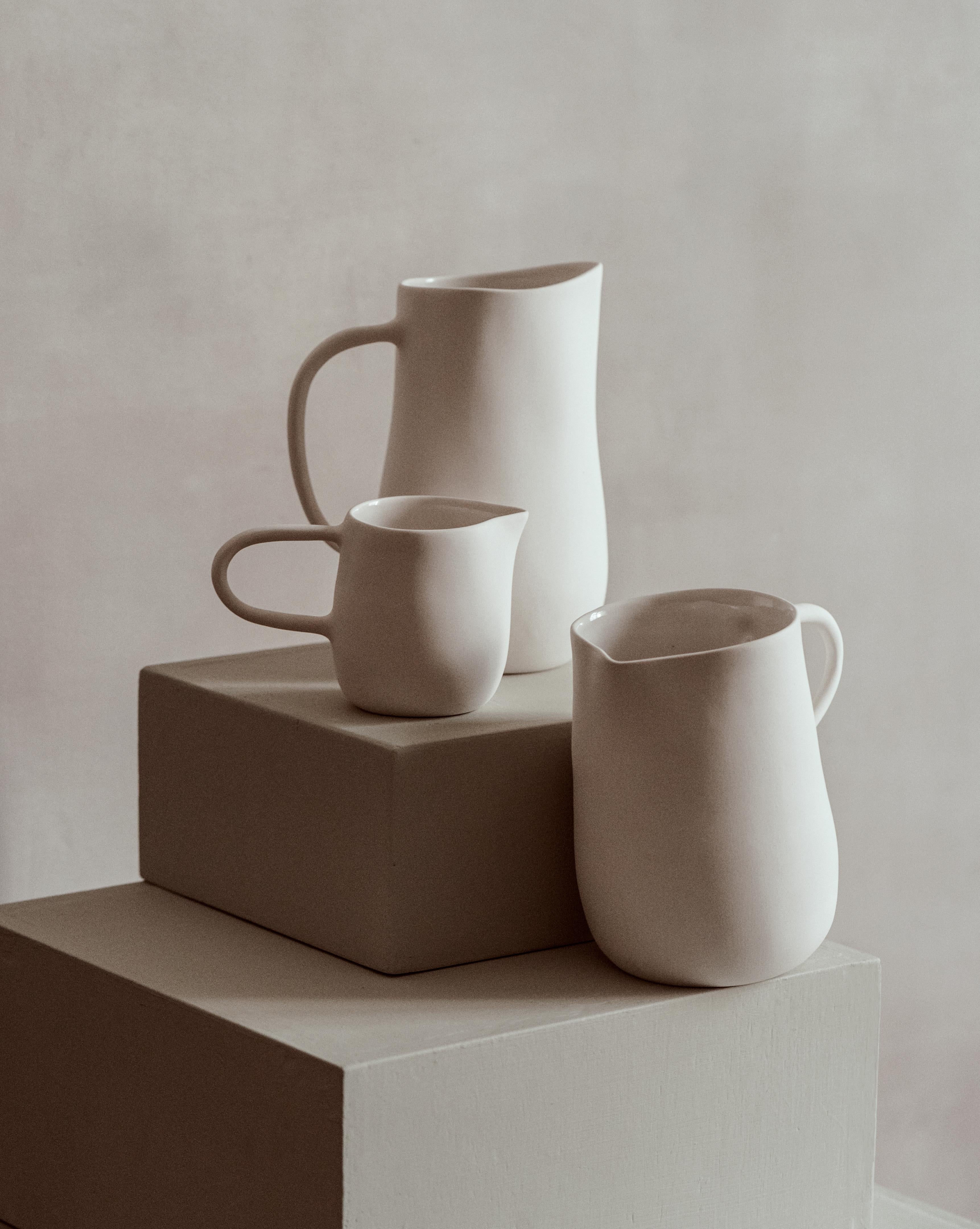 Set of 3 The Family Jug by Kilzi
Dimensions: Mum jug: D 16.5 x W 11 x H 20.9 cm.
Dad jug: D 16.9 x W 12 x H 17.3 cm.
Kid jug: D 15.5 x W 7.2 x H 9.6 cm.
Materials: porcelain with a matte finish on the outside, and transparent shiny glaze on the