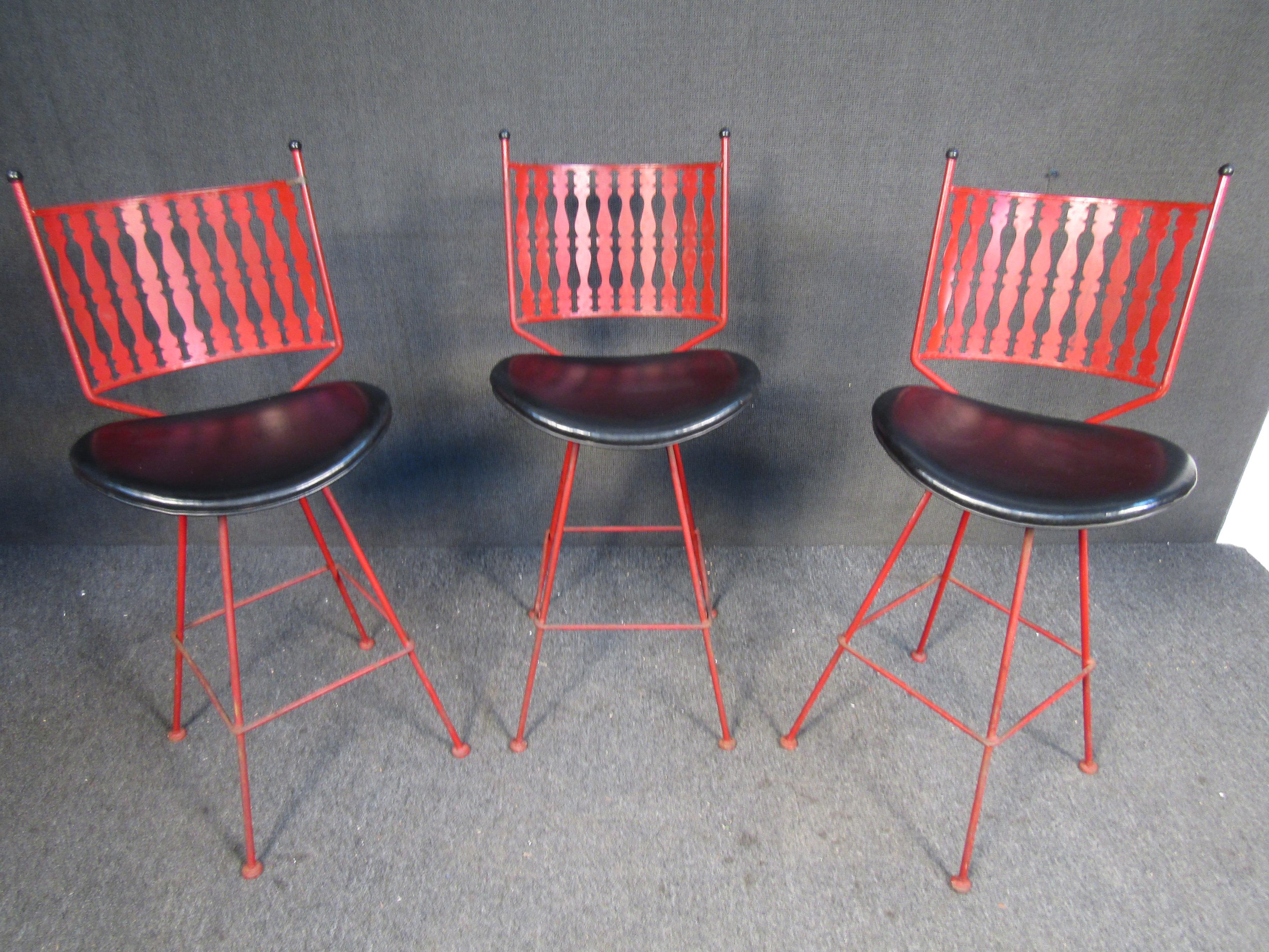 This vintage set of bar stools by Umanoff combine painted wrought iron frames with upholstered seats. Please confirm item location with seller (NY/NJ).