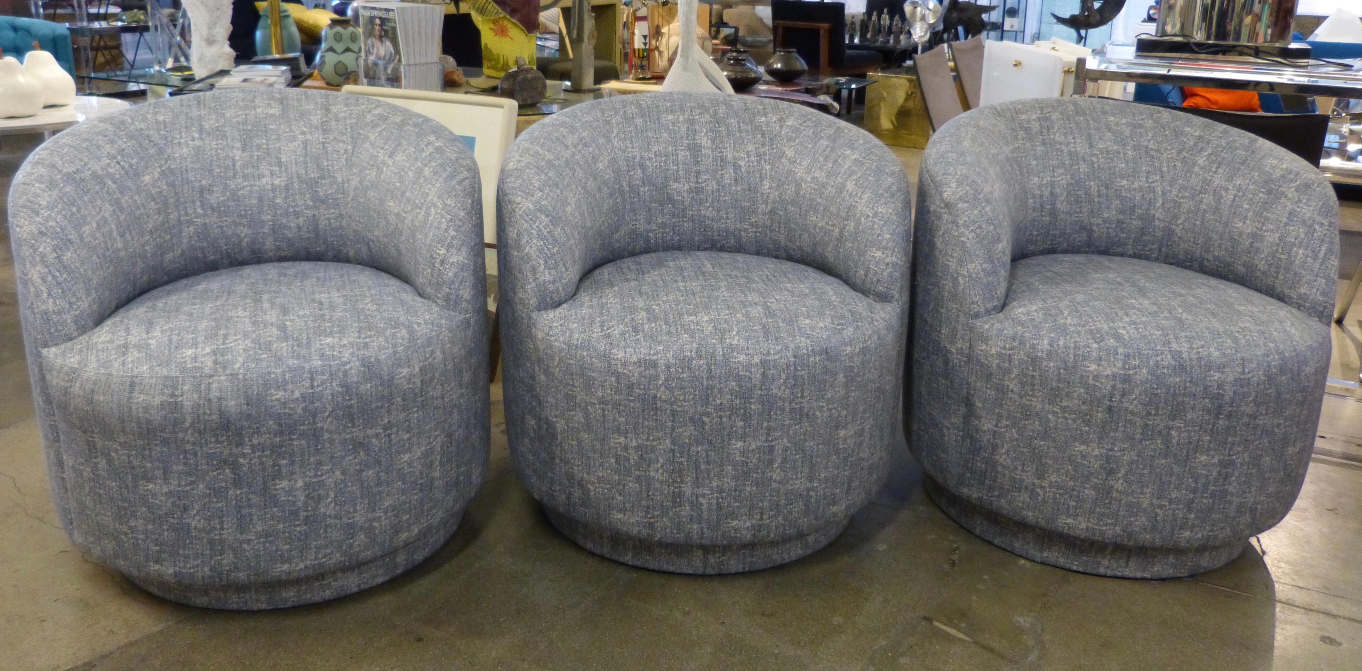 A set of 3 newly re-upholstered chairs on castors. These can be used as lounge, dining or counter top chairs. They have 19 set heights. Likely J Robert Scott or A Rudin.