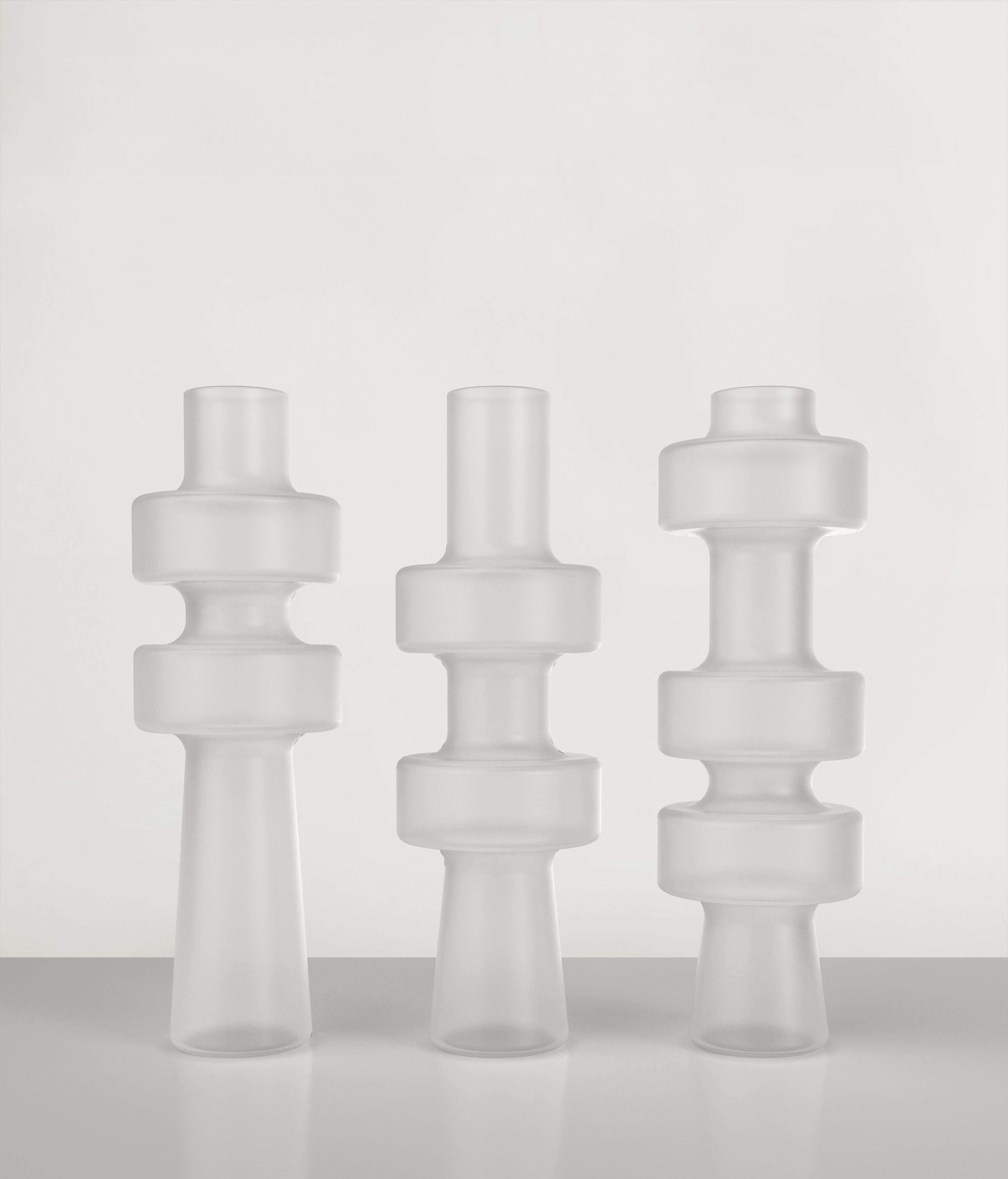 Set of 3 Uppa vases by Edizione Limitata
Limited Edition of 1000 pieces. Signed and numbered.
Dimensions: D12 x H38 cm
Materials: Sanded Glass

Uppa is a series of 21st Century sculptural vases made by Italian artisans in blown sanded glass.