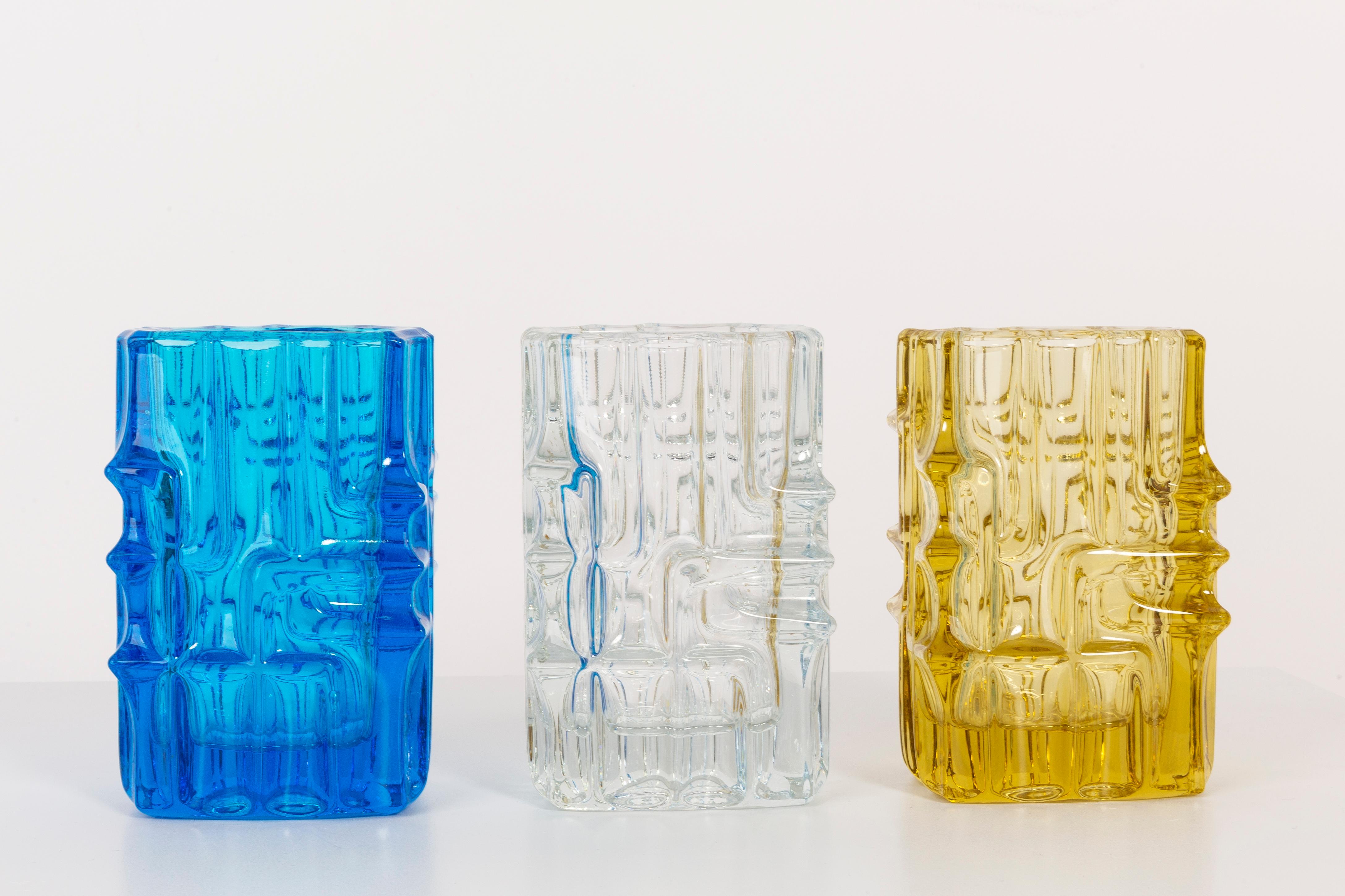 Set of Three Vases by Vladislav Urban, Czechoslovakian glass designer. Produced in 1960s.
Pressed glass in perfect condition. The vases looks like it has just been taken out of the box.
No jags, defects etc. The outer relief surface, the inner