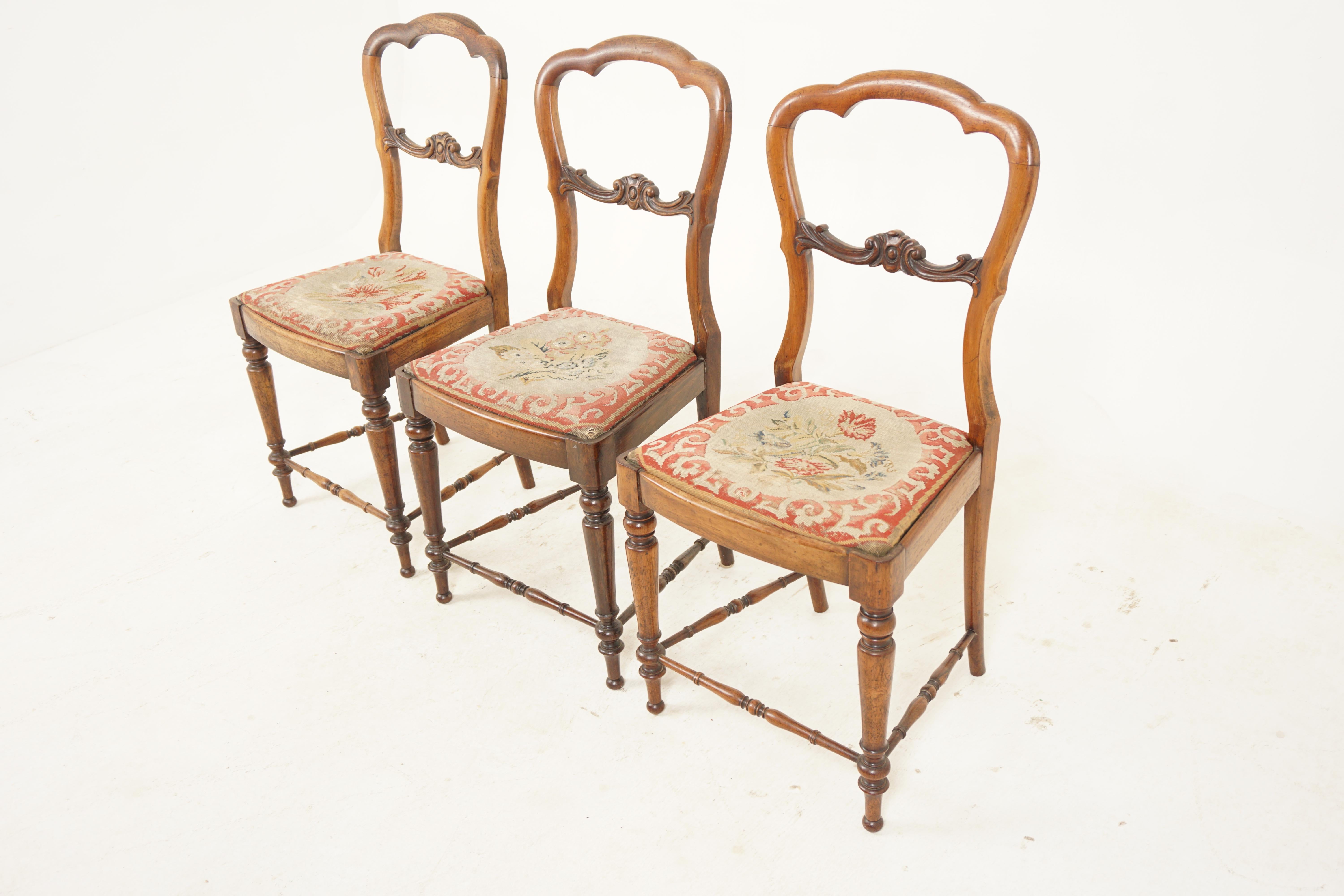 Set of 3 Victorian carved walnut bedroom side chairs, Scotland, 1880.

Scotland, 1880
Solid walnut.
Original finish.
With a wonderful shape carved back and a carved scroll centre cross stretcher.
Needlepoint upholstered shaped seat.
All