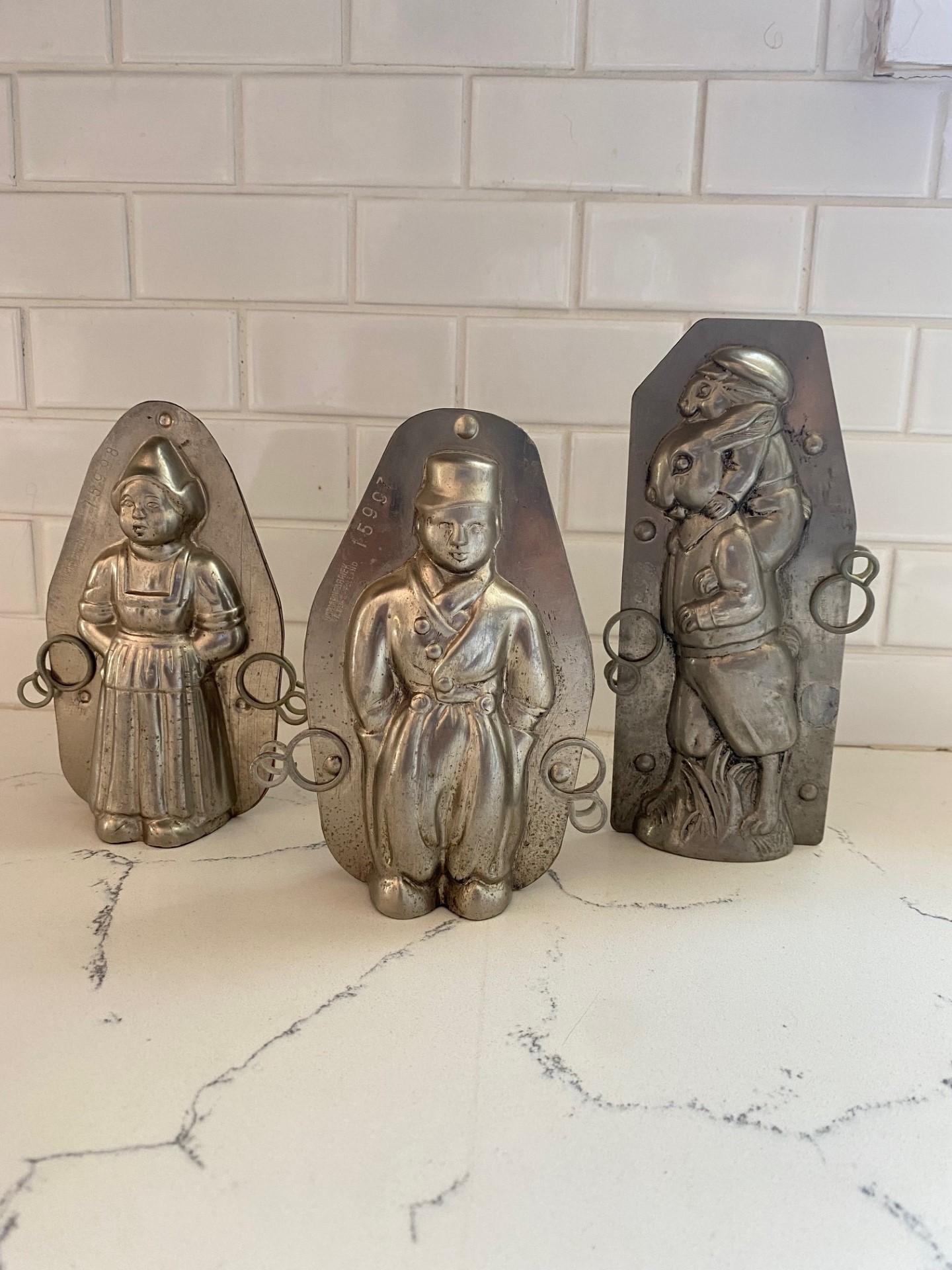 Set of 3 vintage Belgian chocolate molds.  The set includes pair of Belgian children dressed in traditional costume of the Flanders region of Belgium close to the border of Holland and Bunny mold is traditionally vintage in aesthetic.  The