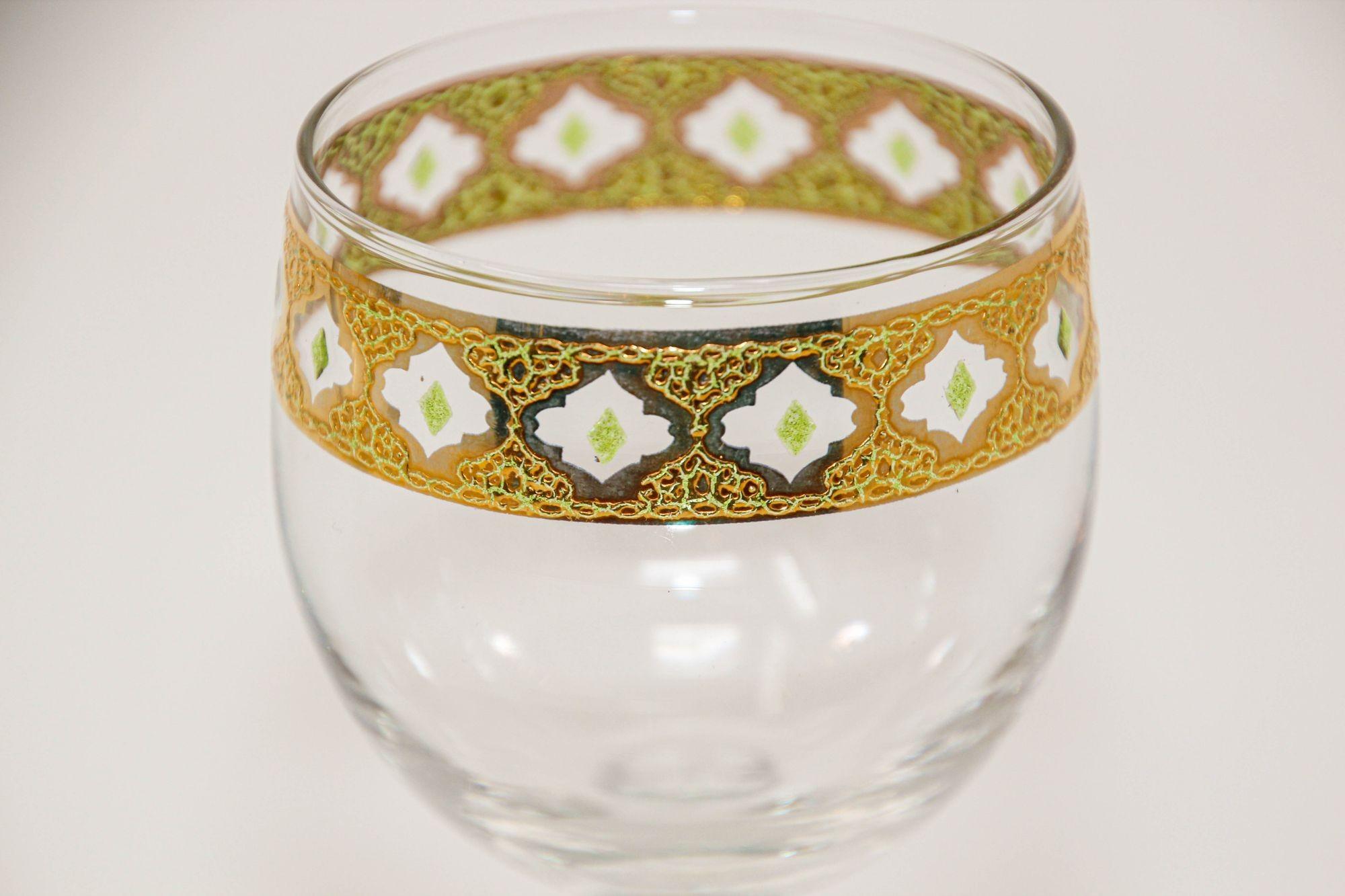 green wine glasses with gold trim