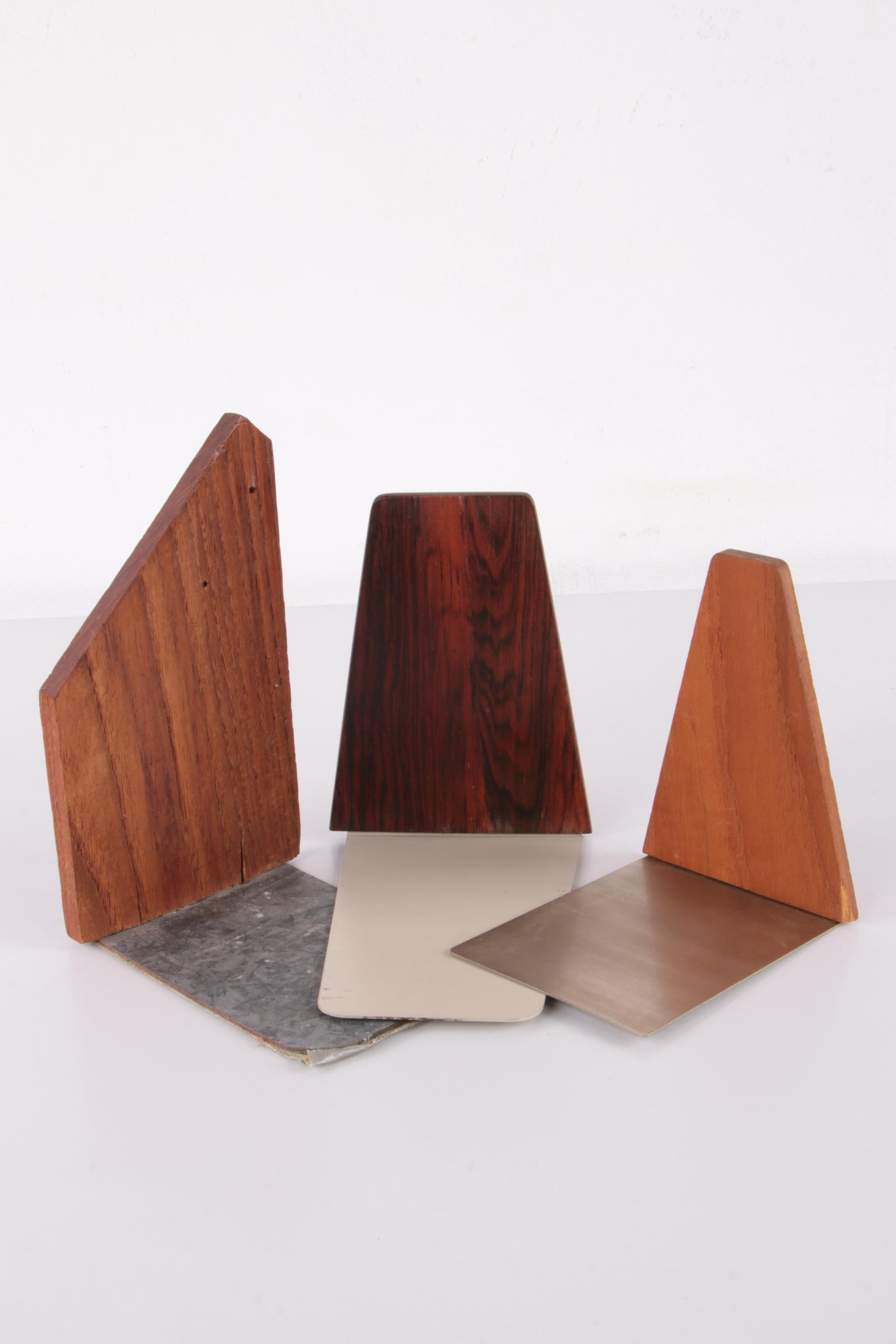 Set of 3 vintage Danish design wooden bookends 1960s


A pair of beautiful mid-century bookends, made of rosewood and teak wood with metal bases in very good condition.

Vintage rosewood and teak wood bookends in a set of 3 made in Denmark.