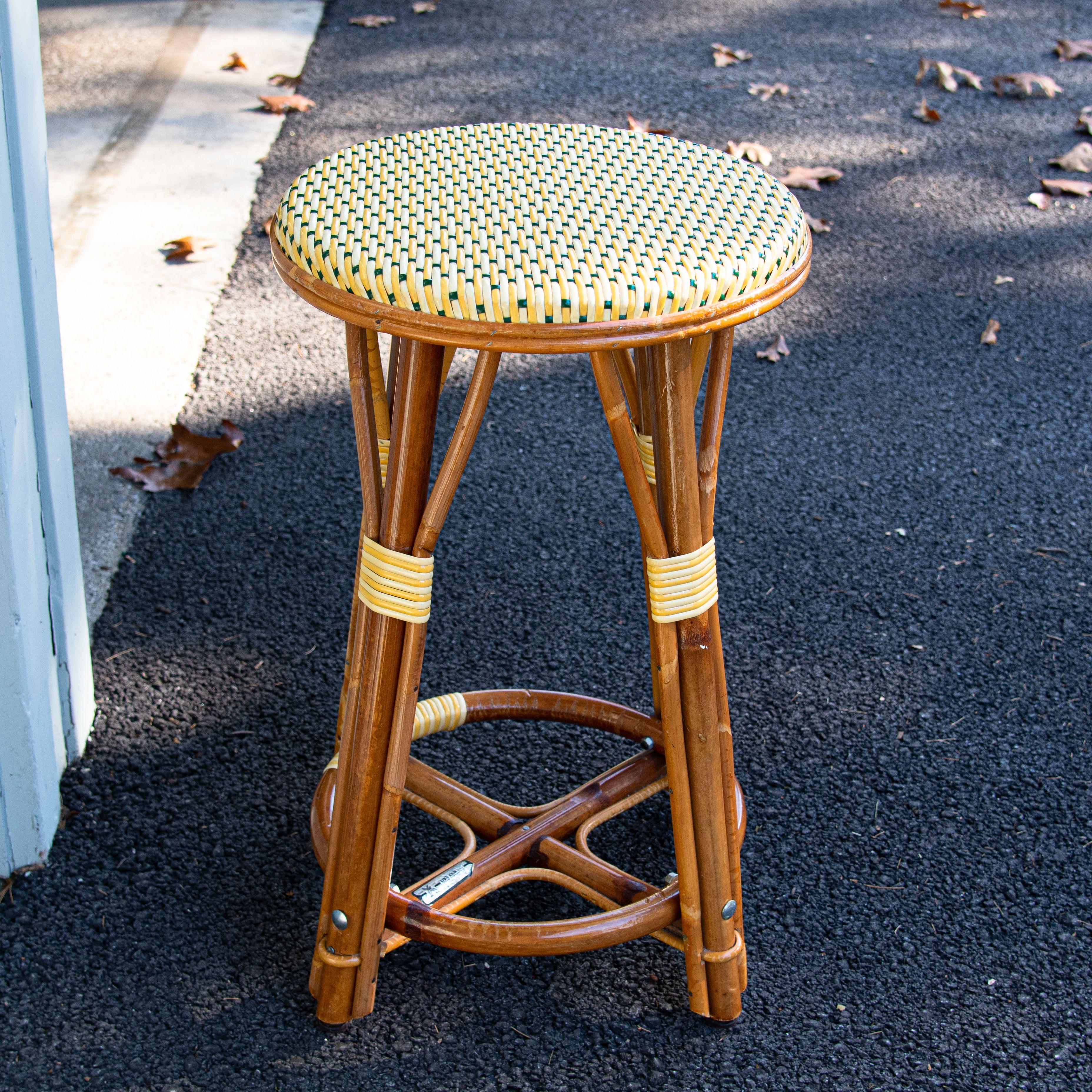 Classic Parisian backless stools. The rattan frame is crafted in a time-honored technique perfected by the French, bent and shaped by hand until the iconic shape is achieved and the rattan’s subtle variations enhance the beauty of the weave for a