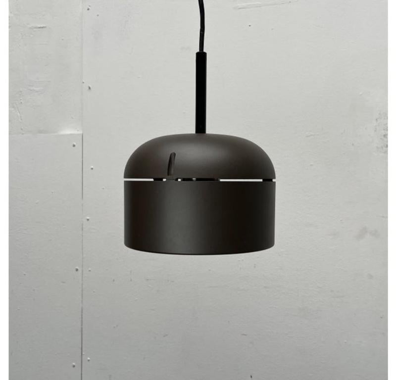 Three Space Age pendant lights from the well-known manufacturer Staff based on a design by Arnold Berges from the 70s.

The simple lamp body is made of plastic and painted dark brown. A striking detail is the perforation on the top. A functional