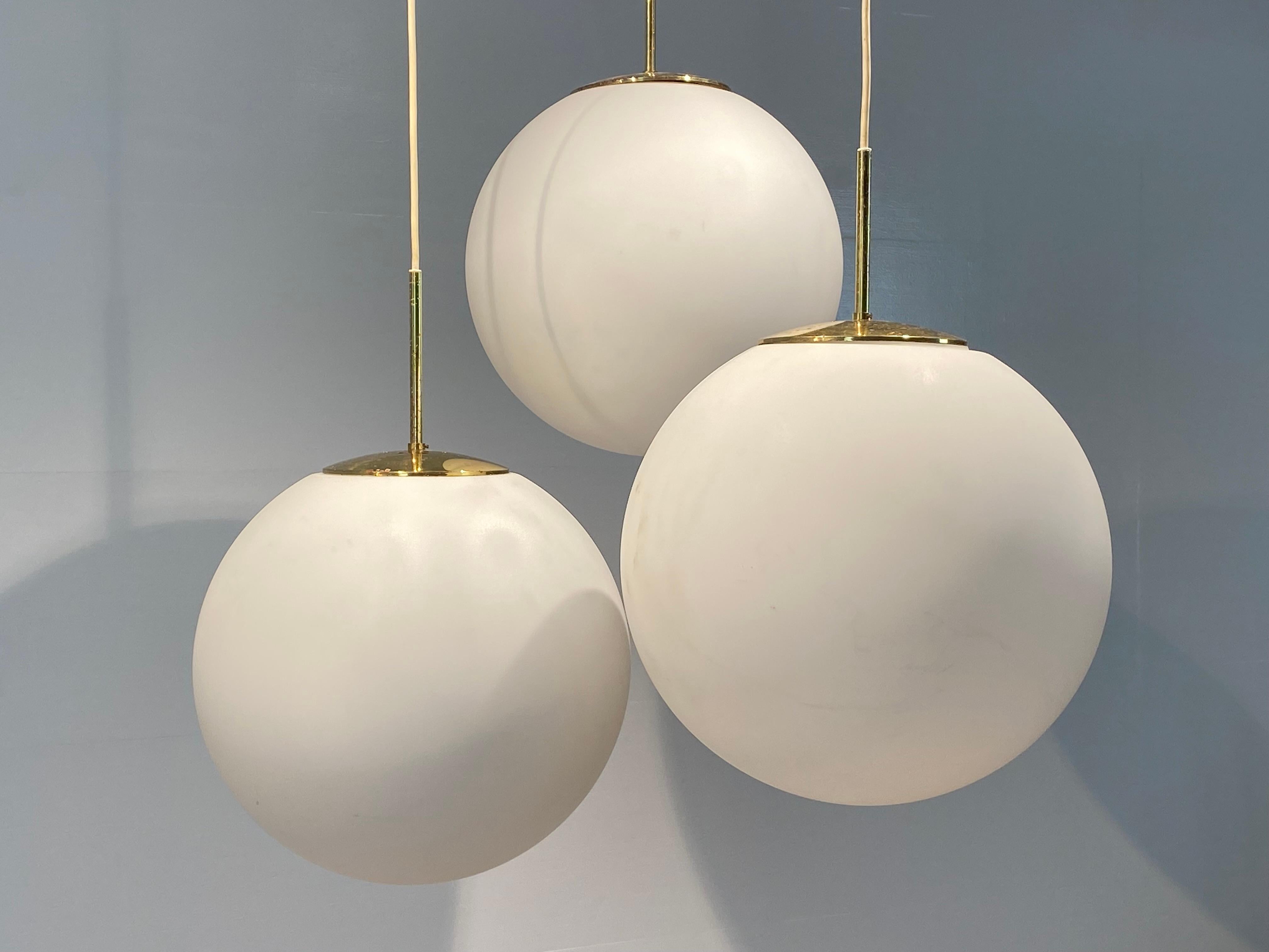 Exceptional Set of 3 Vintage Sandblasted Glass Balls,
Germany from around  the 1970 ies,
all is original, fittings etc...,
the lamps can be hung in different heights ,
great shine and patina of the Glass,
very decorative lighting objets