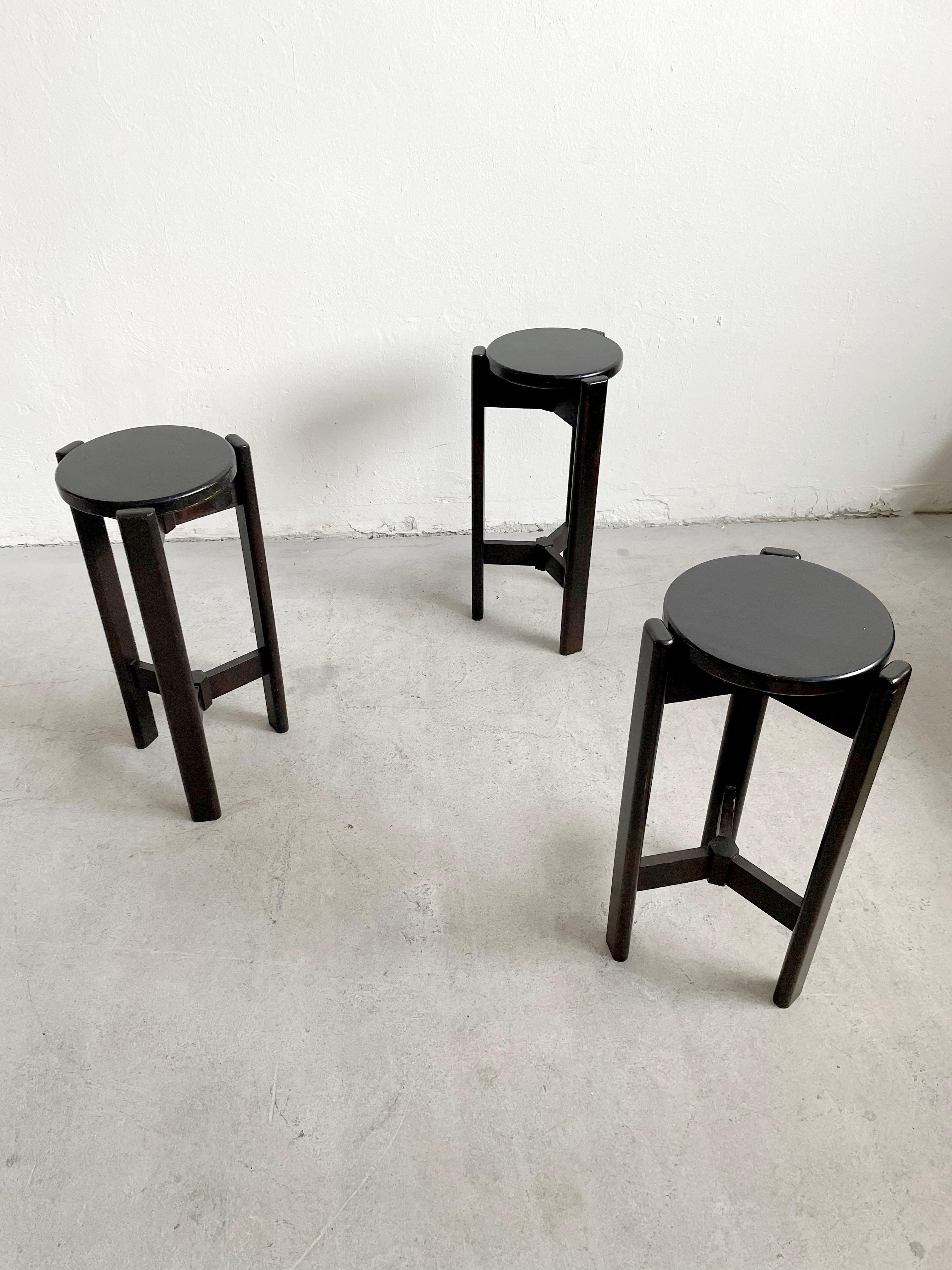 Mid century designer wooden bar stool painted in matte black, c 1960's - 1970's

Design reminiscent of Bruno Rey chairs

Sold as a set of 3 

The chairs are in very good vintage condition with small traces of cosmetic wear. The structure is without