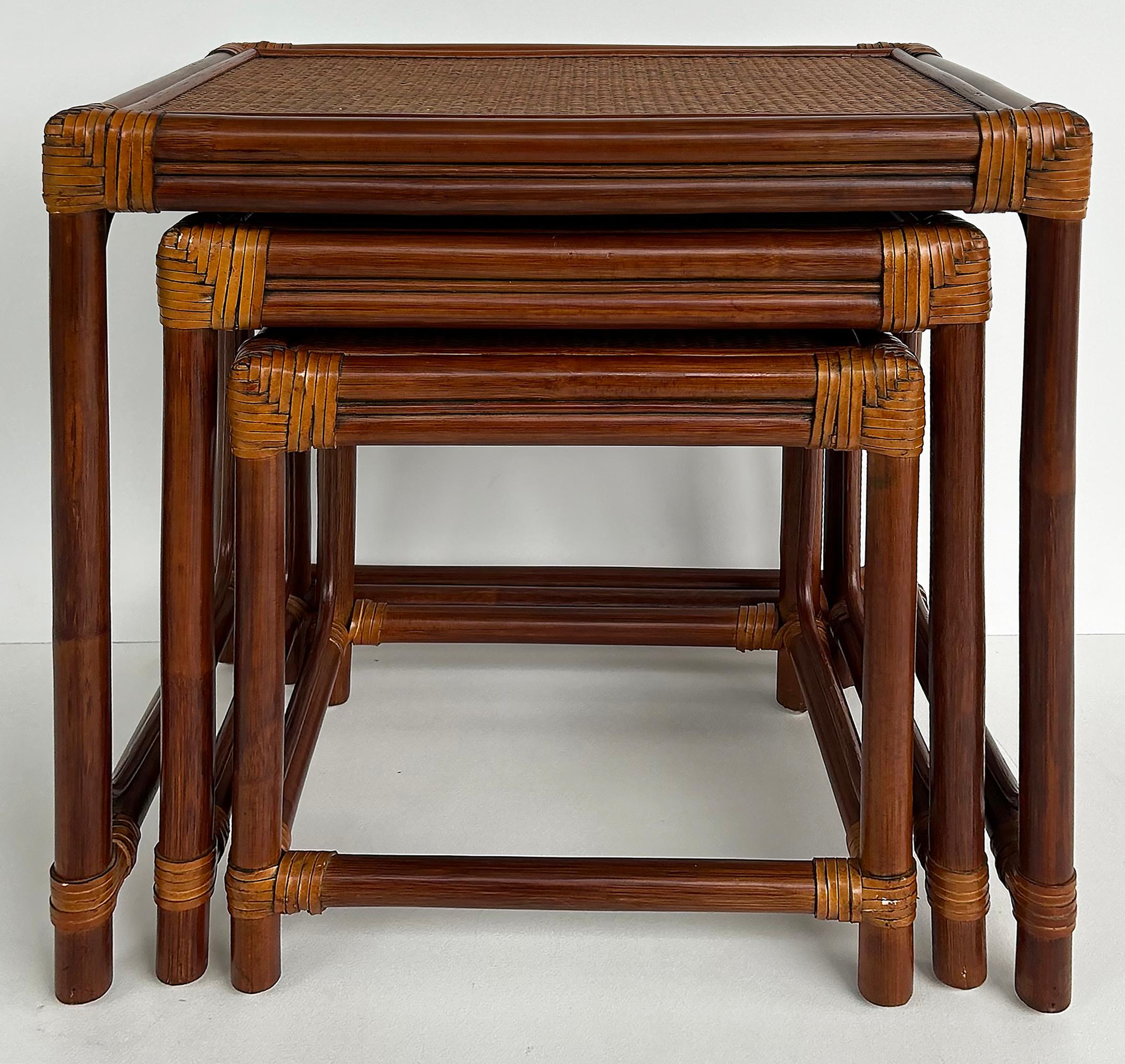 Set of 3 Vintage Rattan, Grass Cloth Nesting Tables, McGuire Manner

Offered for sale is a set of three (3) rattan nesting tables with woven grass cloth tops and rawhide-wrapped corners and joints. The tables have bent rattan details and are quite