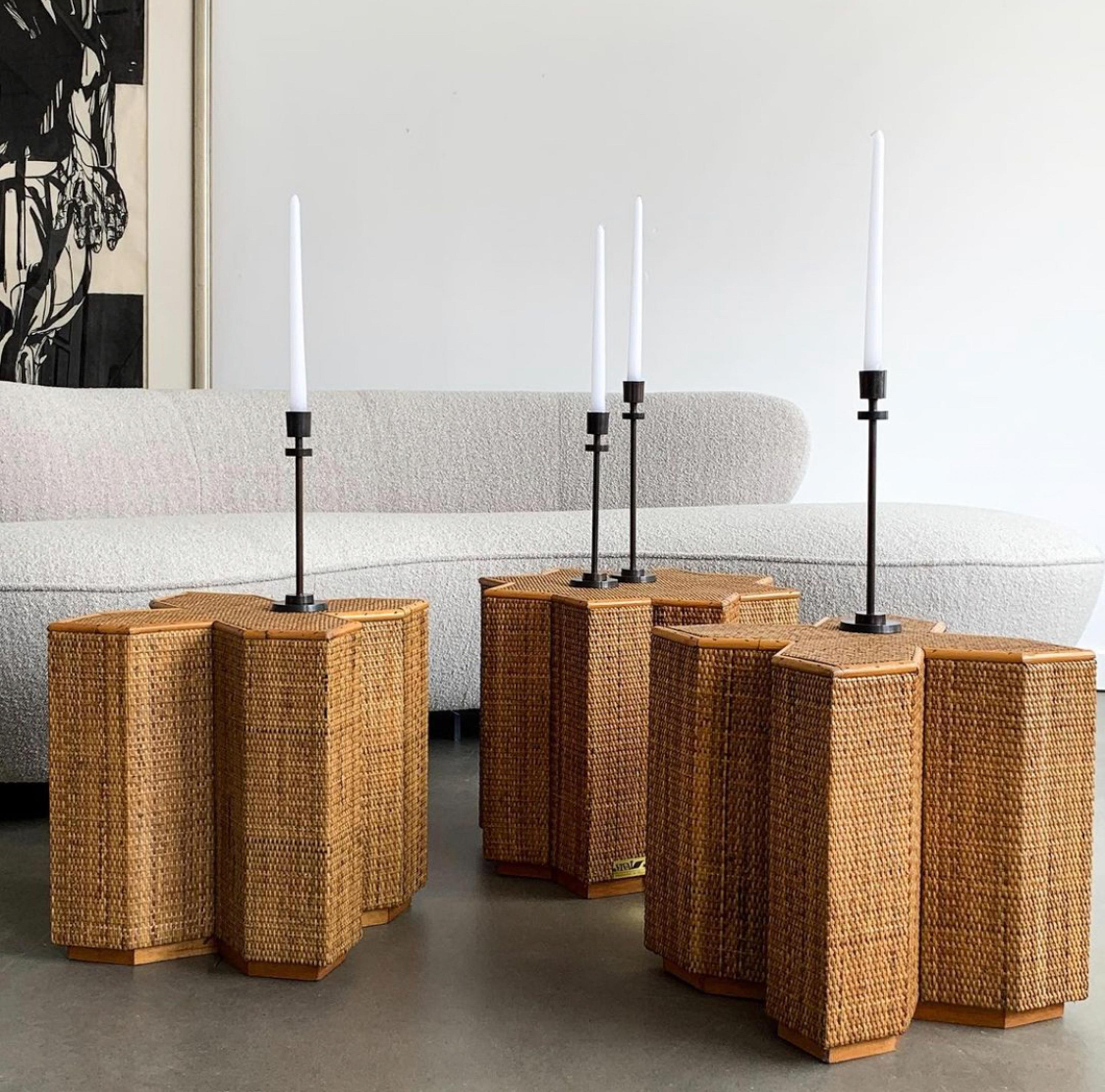 A set of three 1970s Italian cane and rattan wrapped wooden frame tables by Vivai del Sud. Two of the tables are X-shaped and one is star-shaped. These sculptural tables can be interlocked to create a coffee table or can be placed separately