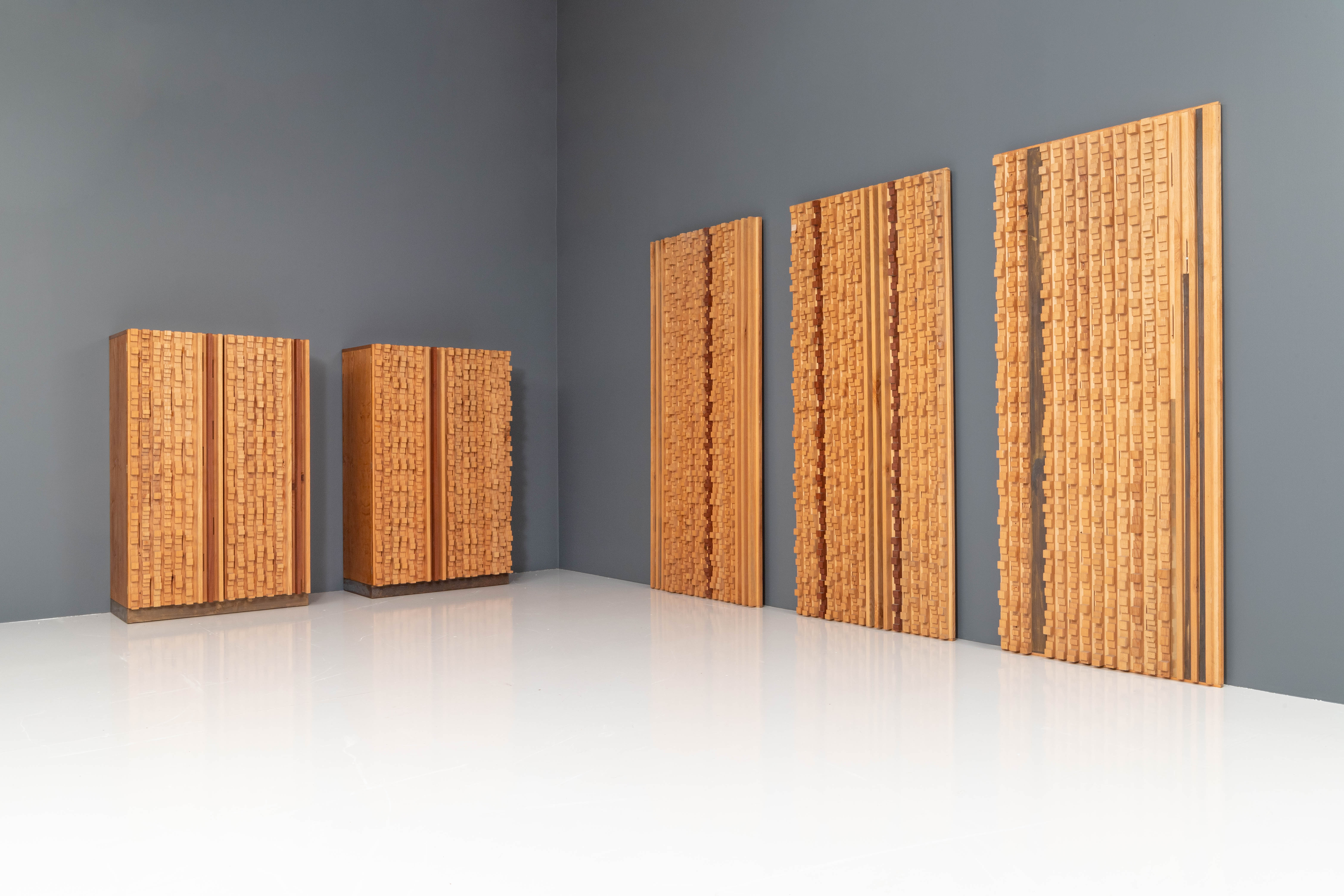 Unique and custom built set of 3 Wall Panels and 2 brutalist Cabinets by the Italian sculptor Stefano d’Amico in beech and brass, signed and dated, 1974.

There is not so much known about D'Amico's work apart from that he held expositions in Milan
