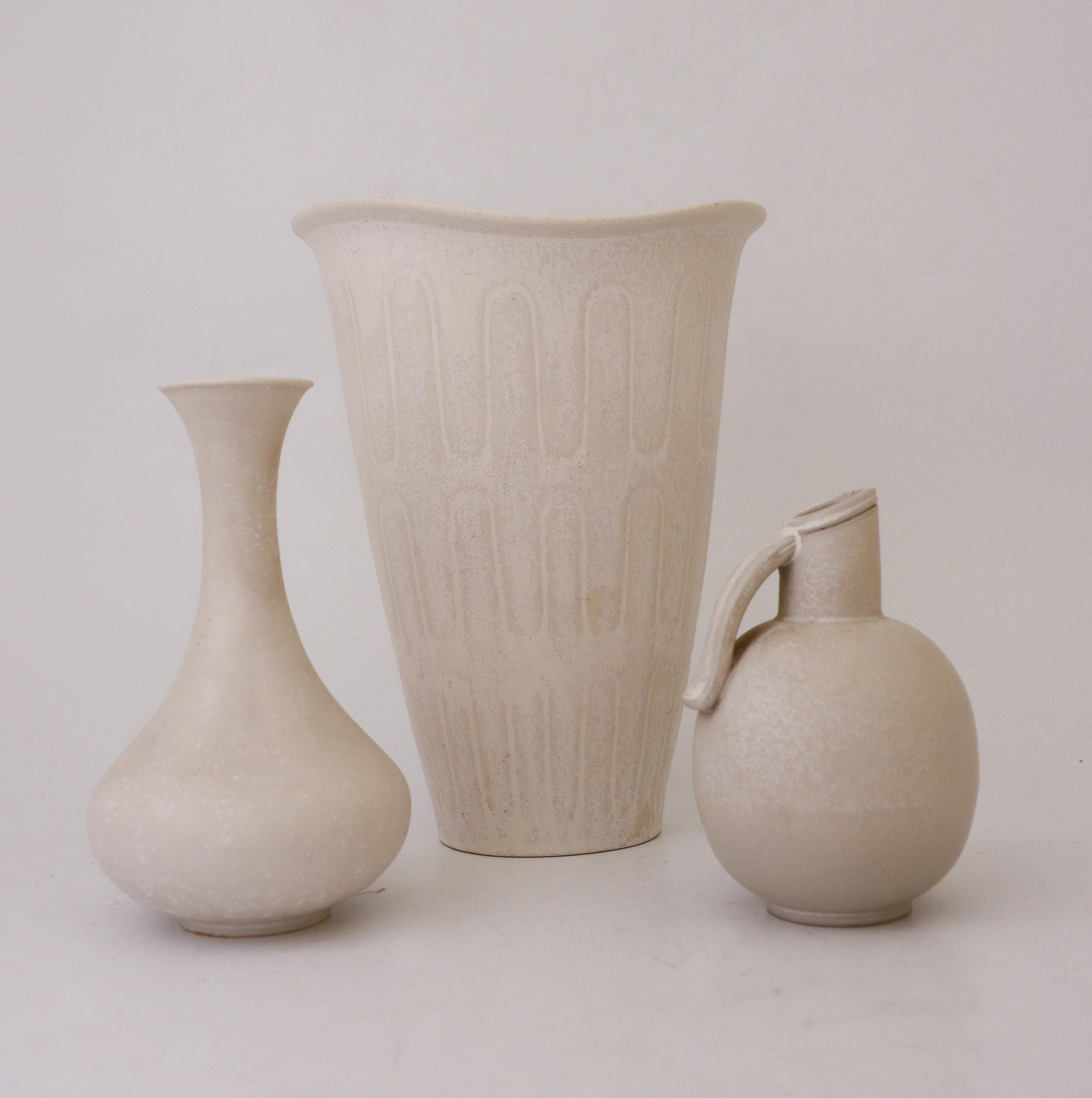 A group of three pieces of white ceramic vases designed by Gunnar Nylund at Rörstrand, the pieces are 23, 16.5 and 12.5 cm high. All pieces are first quality. They are in very good condition except from some minor marks. 

Gunnar Nylund was born