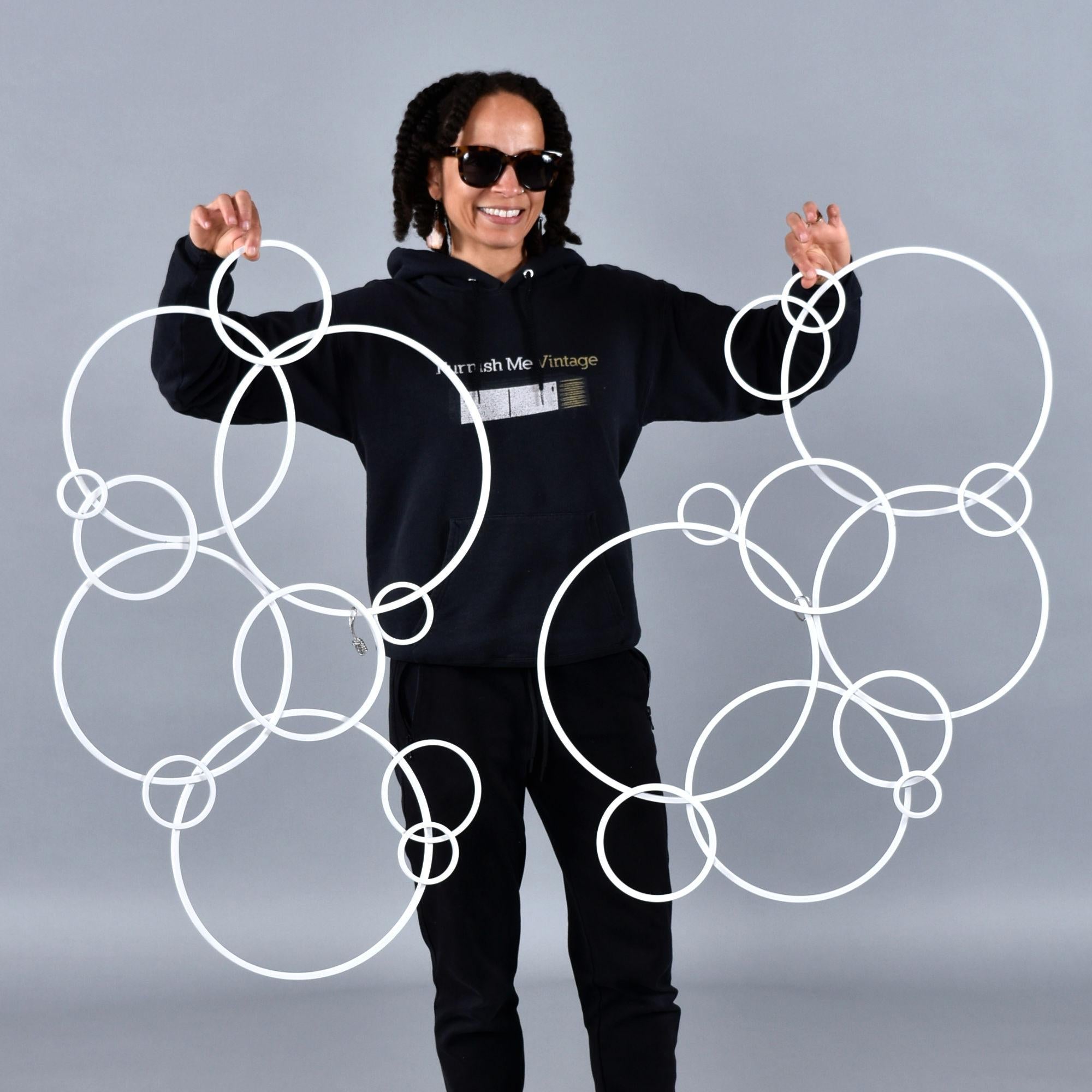 Get creative with your wall decor. This group of three circular metal wall sculptures can be arranged in many ways. Position them in a group of three to add interest to a large wall. Otherwise use two together in one spot and one elsewhere. Further,