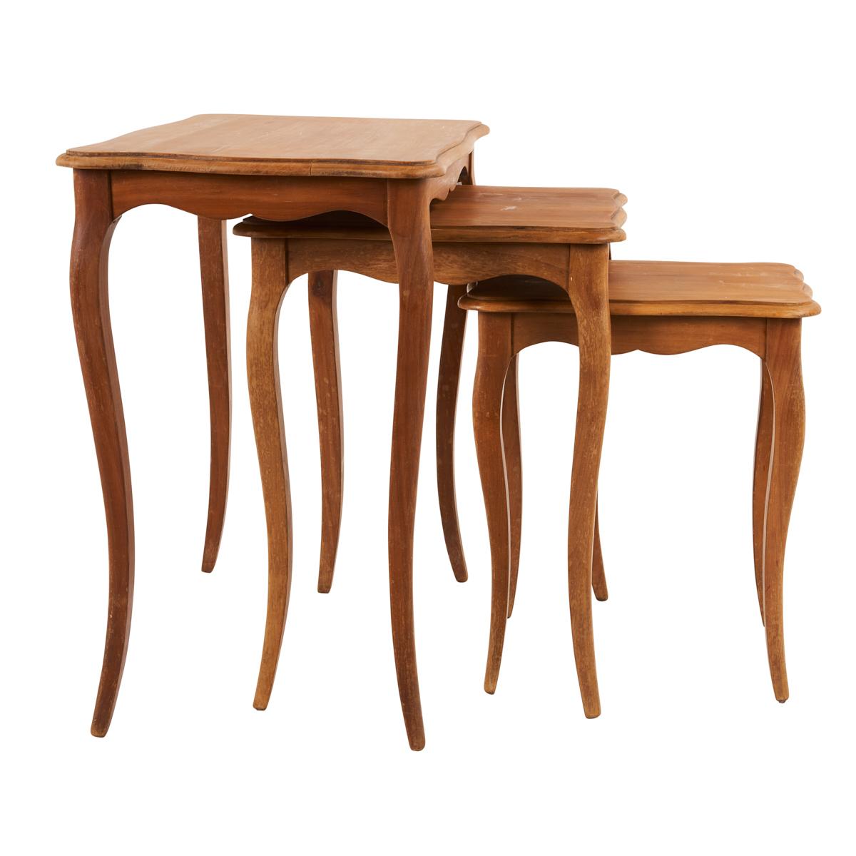 A wonderful vintage find from France, this trio of wood nesting tables is timeless, elegant and infinitely useful. Their soft silhouettes and delicate proportions make them extremely versatile and easy to place.
  