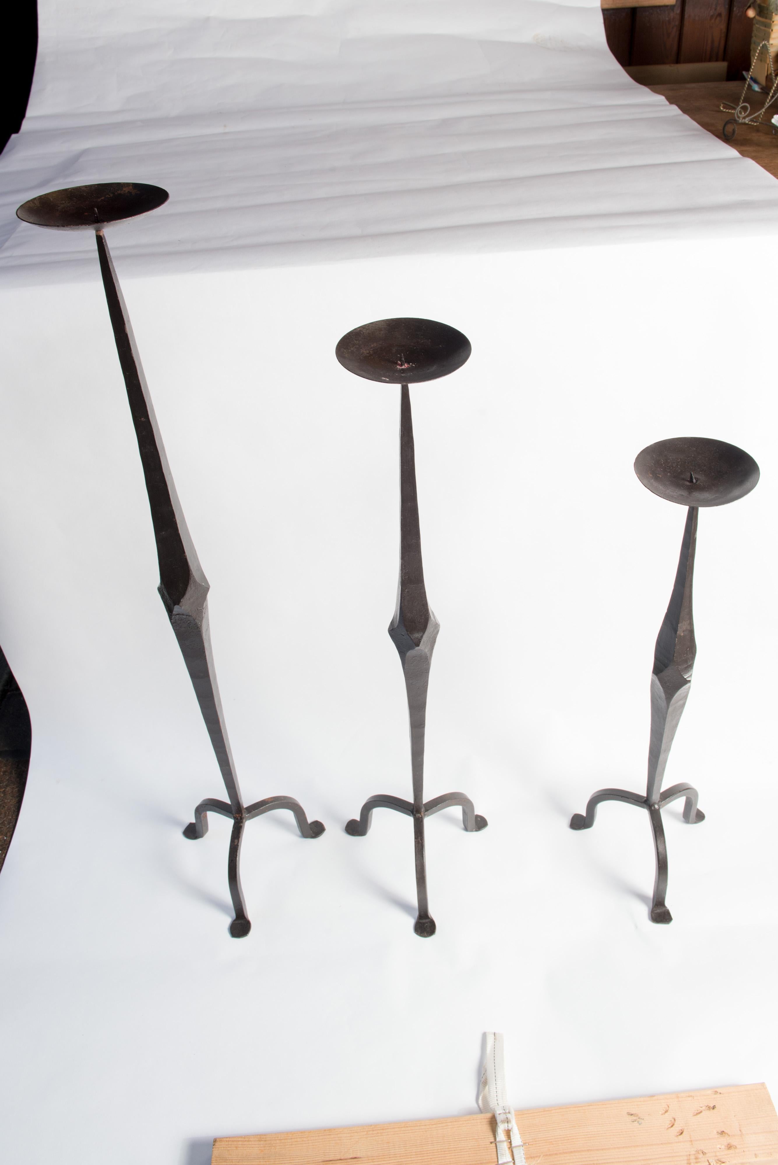 A set of three large floor standing hand wrought iron torchere candle holders from the 1960s.
Heights: 30